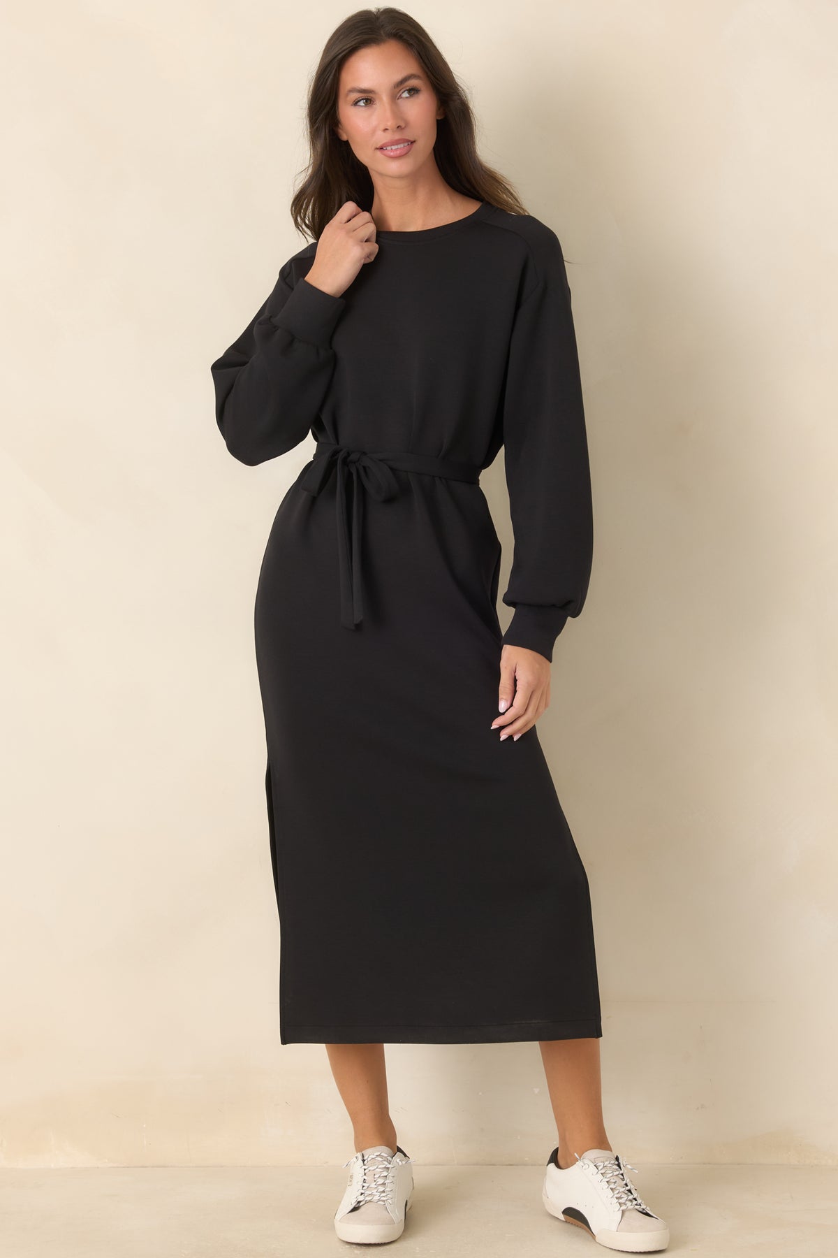 Classic black midi dress with a crew neckline, adjustable waist tie, and side-slit skirt.