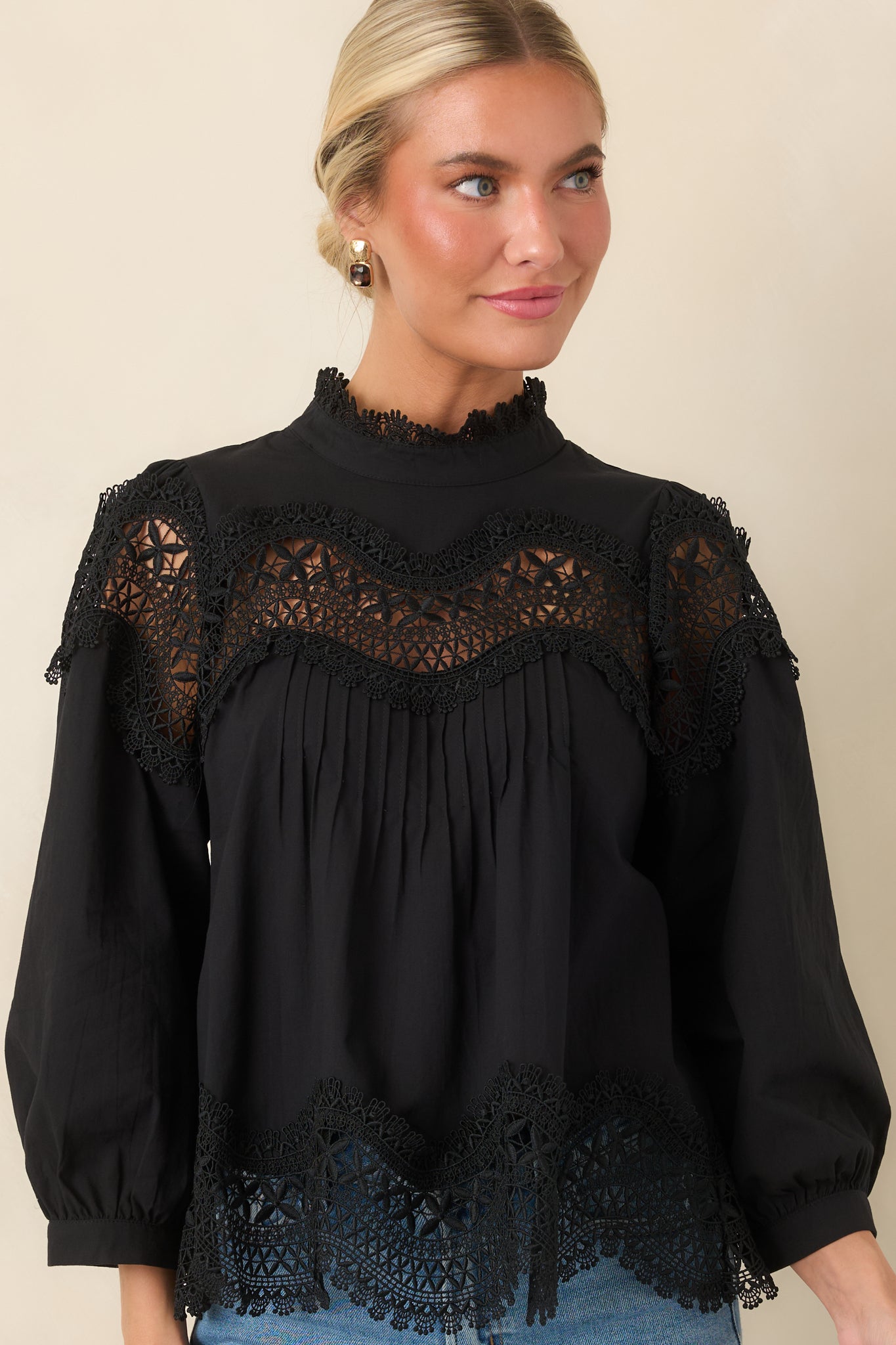 Pintuck detailing adds dimension to the front of this black cotton blouse with lace accents.