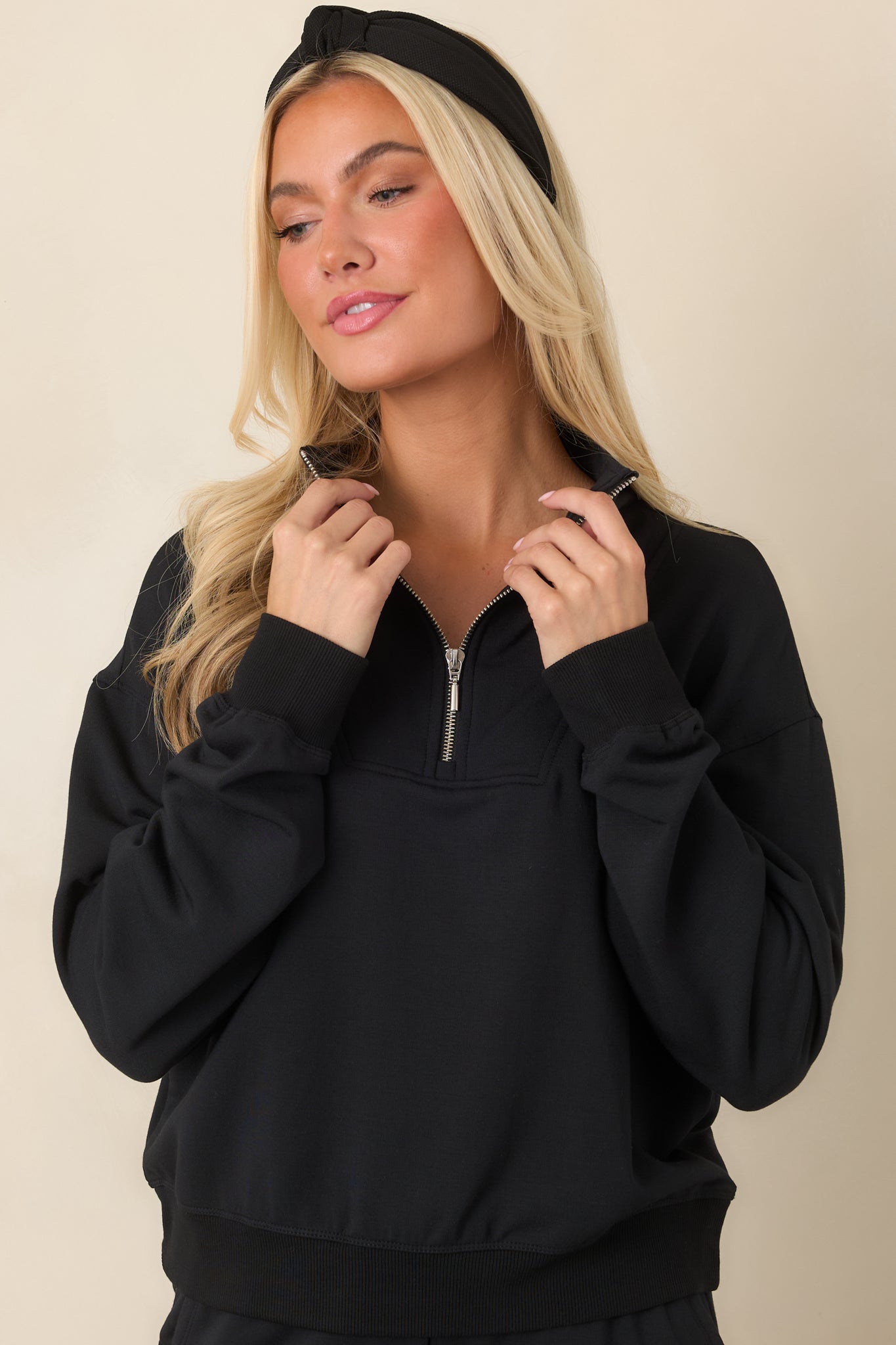Black modal-blend sweatshirt highlighting the dropped shoulder construction, long sleeves, and relaxed upper fit.
