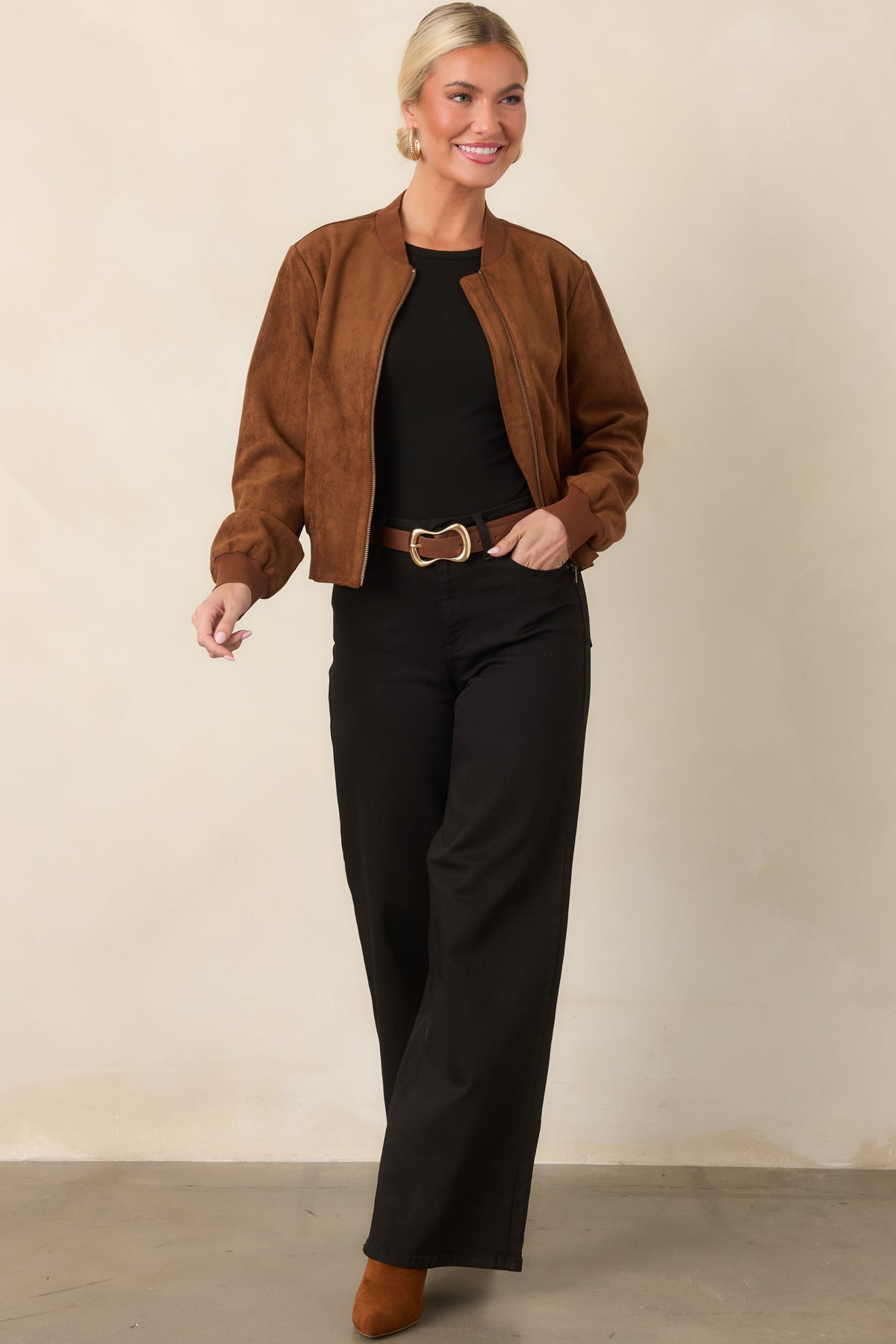 Black fitted top showcasing subtle cap sleeves and smooth stretch fabric.