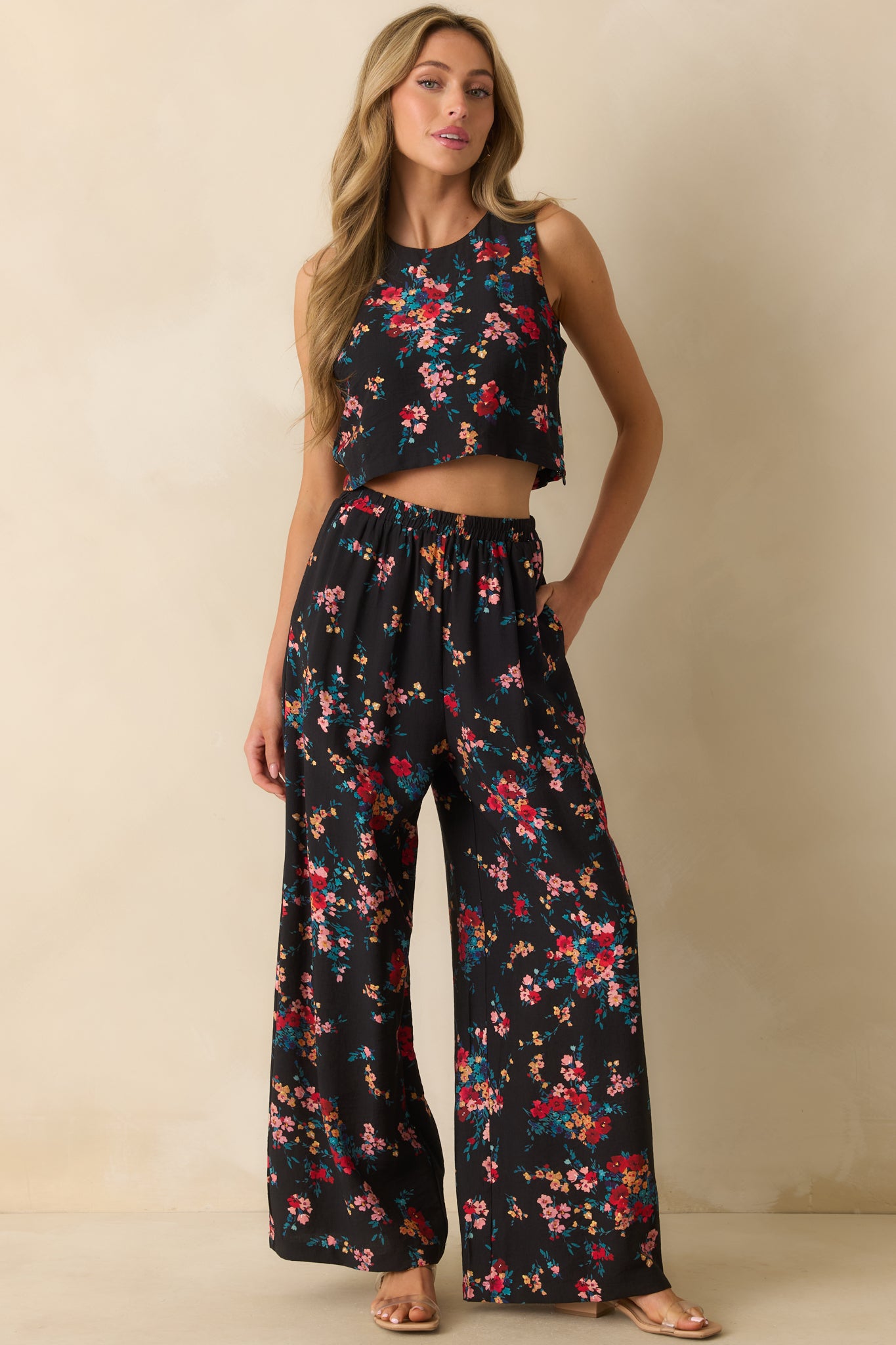 Black floral print top emphasizing the relaxed, casual fit and round neckline