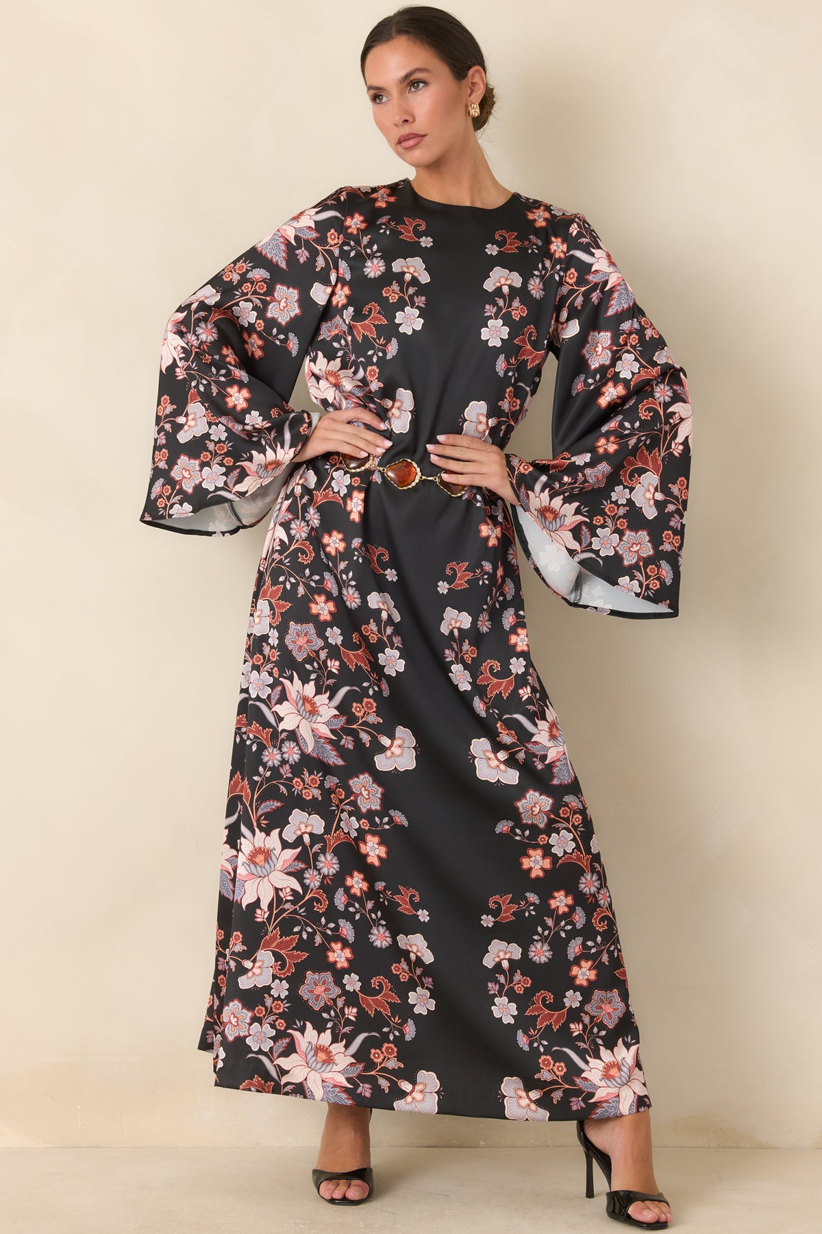 Floral black maxi dress with rust and muted blue blooms against lustrous satin.