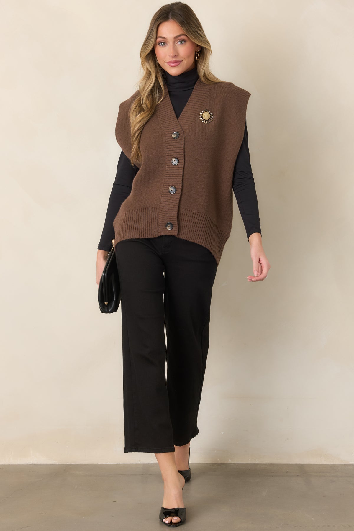 High-rise black jeans designed with a relaxed wide-leg shape and cropped hem for a versatile everyday look.
