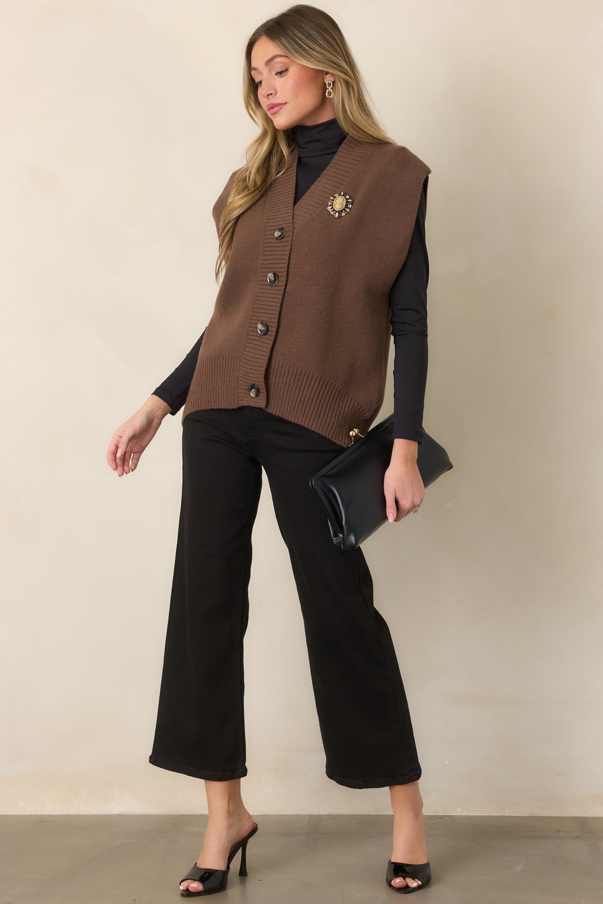 Black jeans featuring a flattering high-rise waist, relaxed wide-leg silhouette, cropped length, and classic five-pocket styling.