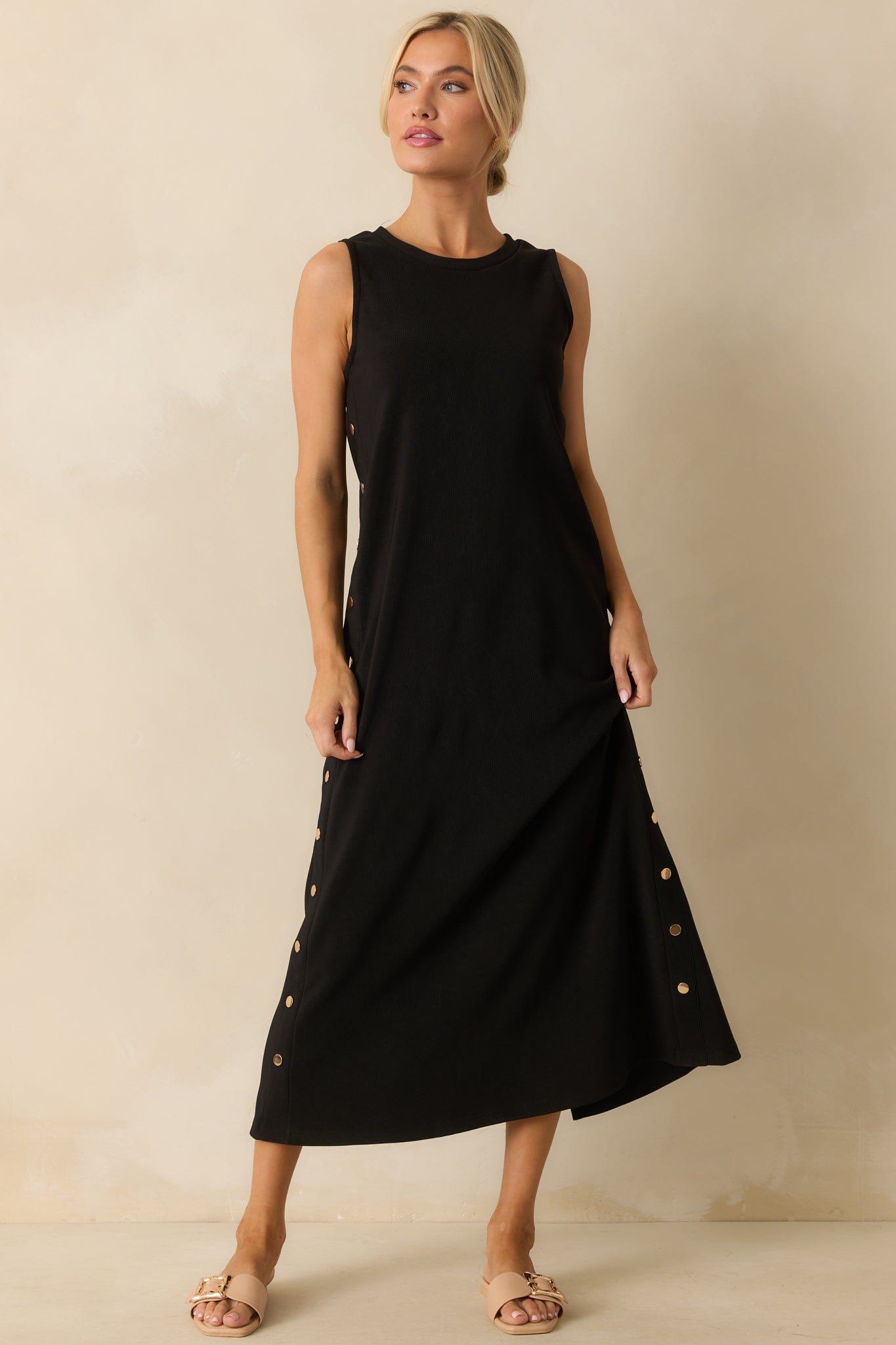 A full front view of the black maxi dress with a crew neckline and relaxed fit.