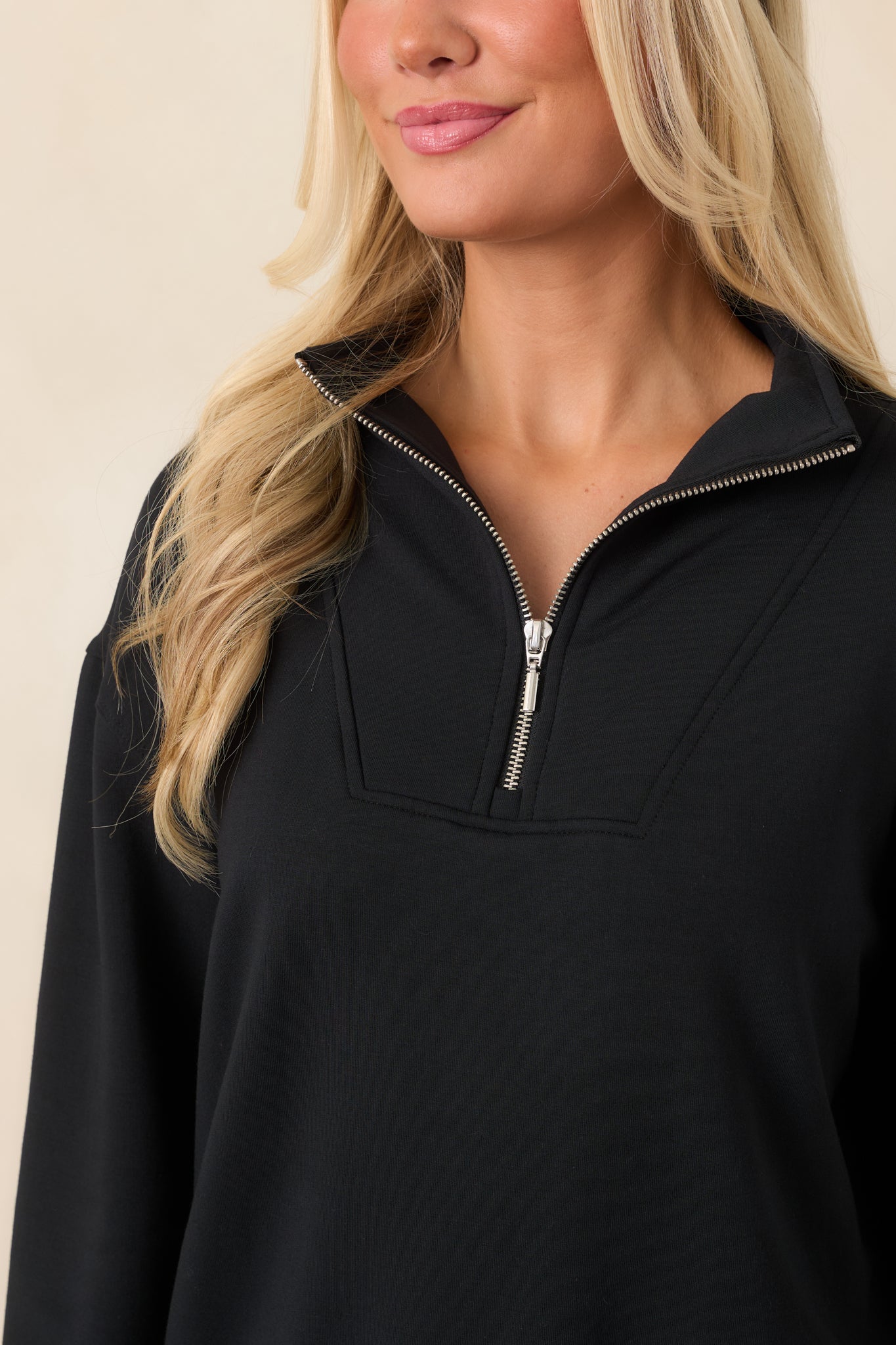 Close-up of the smooth black modal-blend fabric, showing its soft stretch texture and refined finish.