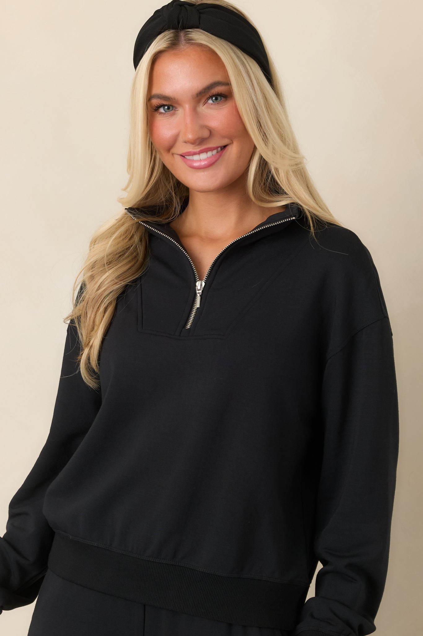 Detailed view of the sweatshirt's soft stretch fabric and ribbed cuff, showcasing its polished casual finish.