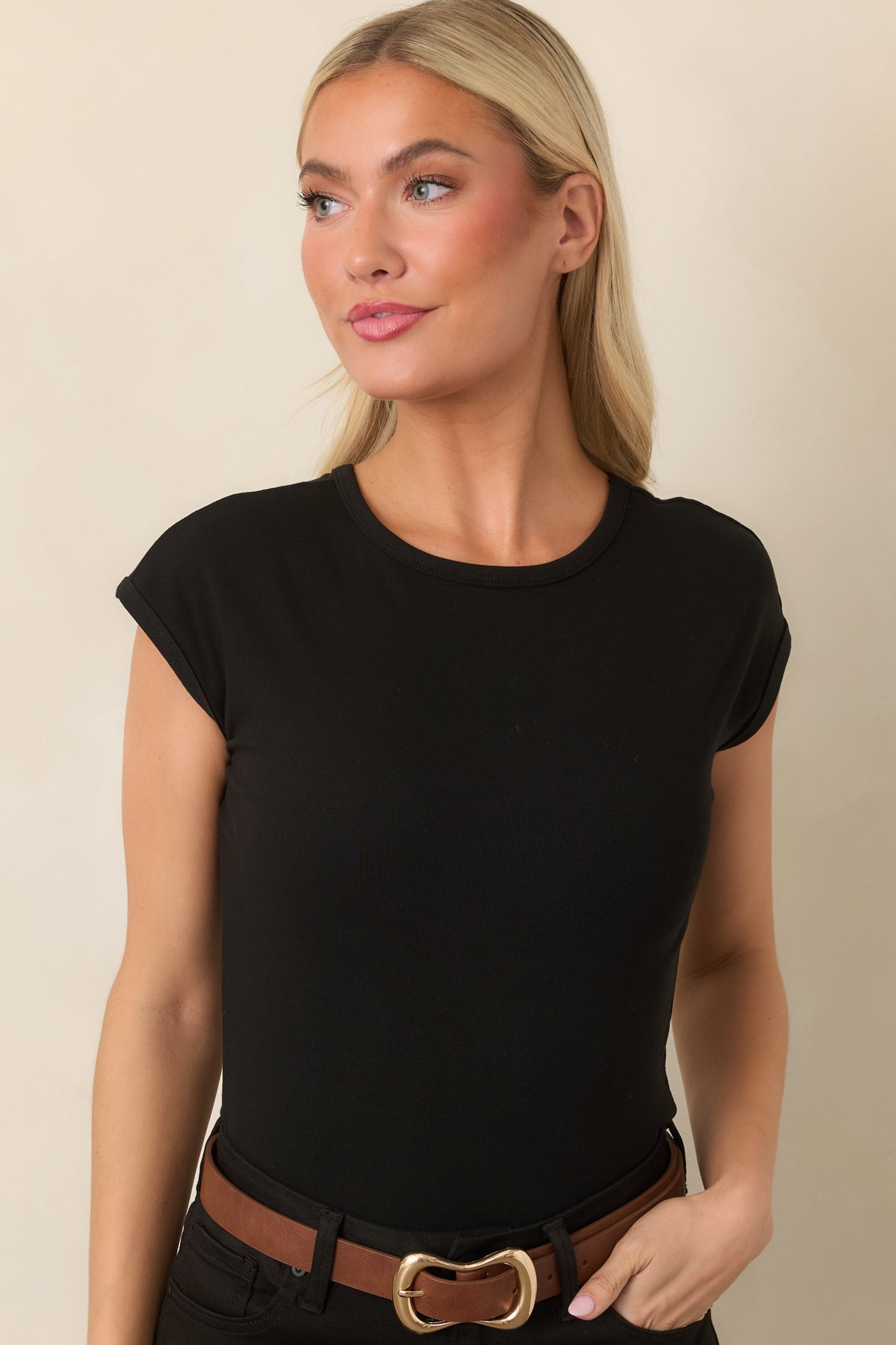 Black rayon-blend top featuring a classic crew neckline and fitted silhouette.