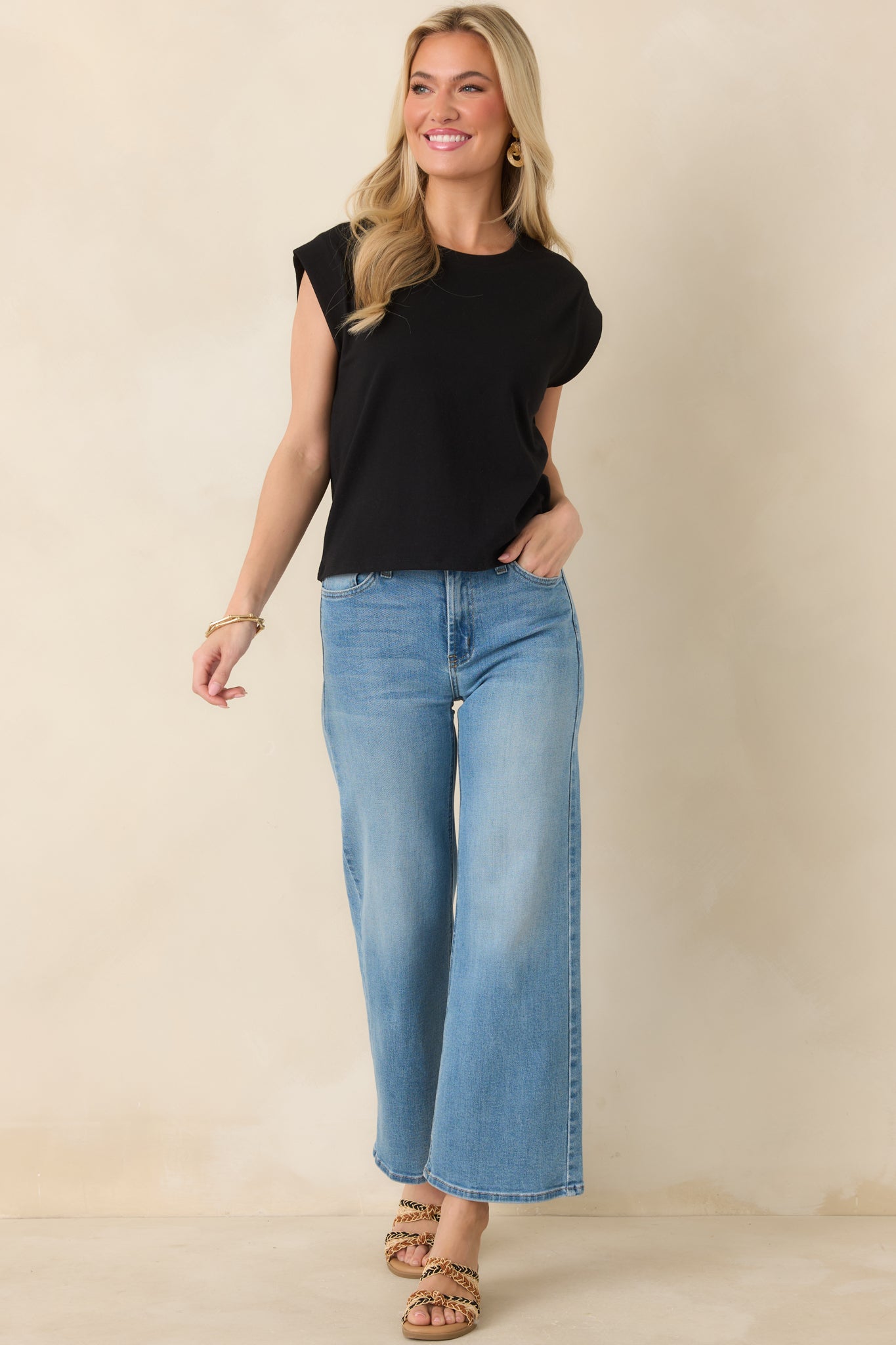 Front view of black tee showcasing lightweight fabric and subtly structured shoulders.