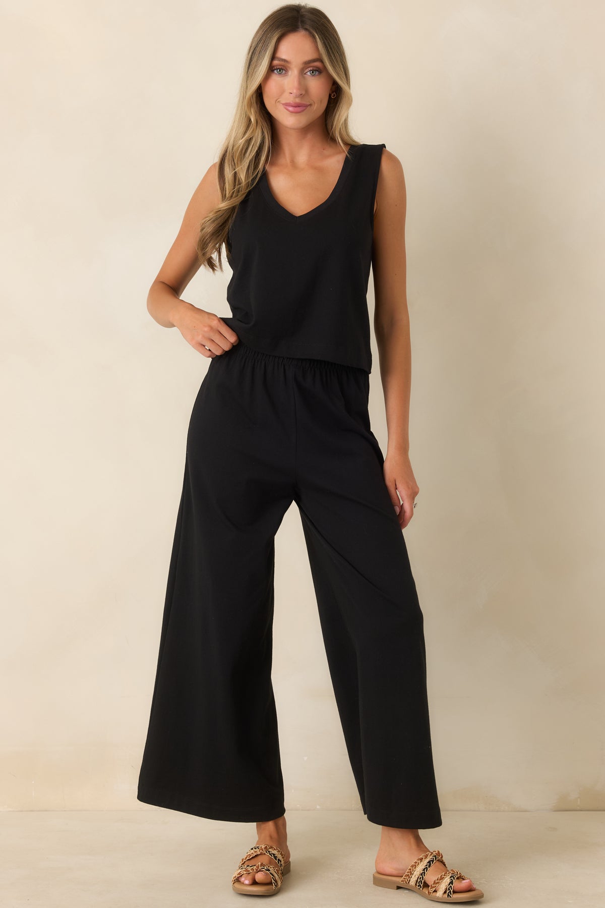 Classic black v-neck tank featuring a comfortable relaxed fit and simple sleeveless construction.