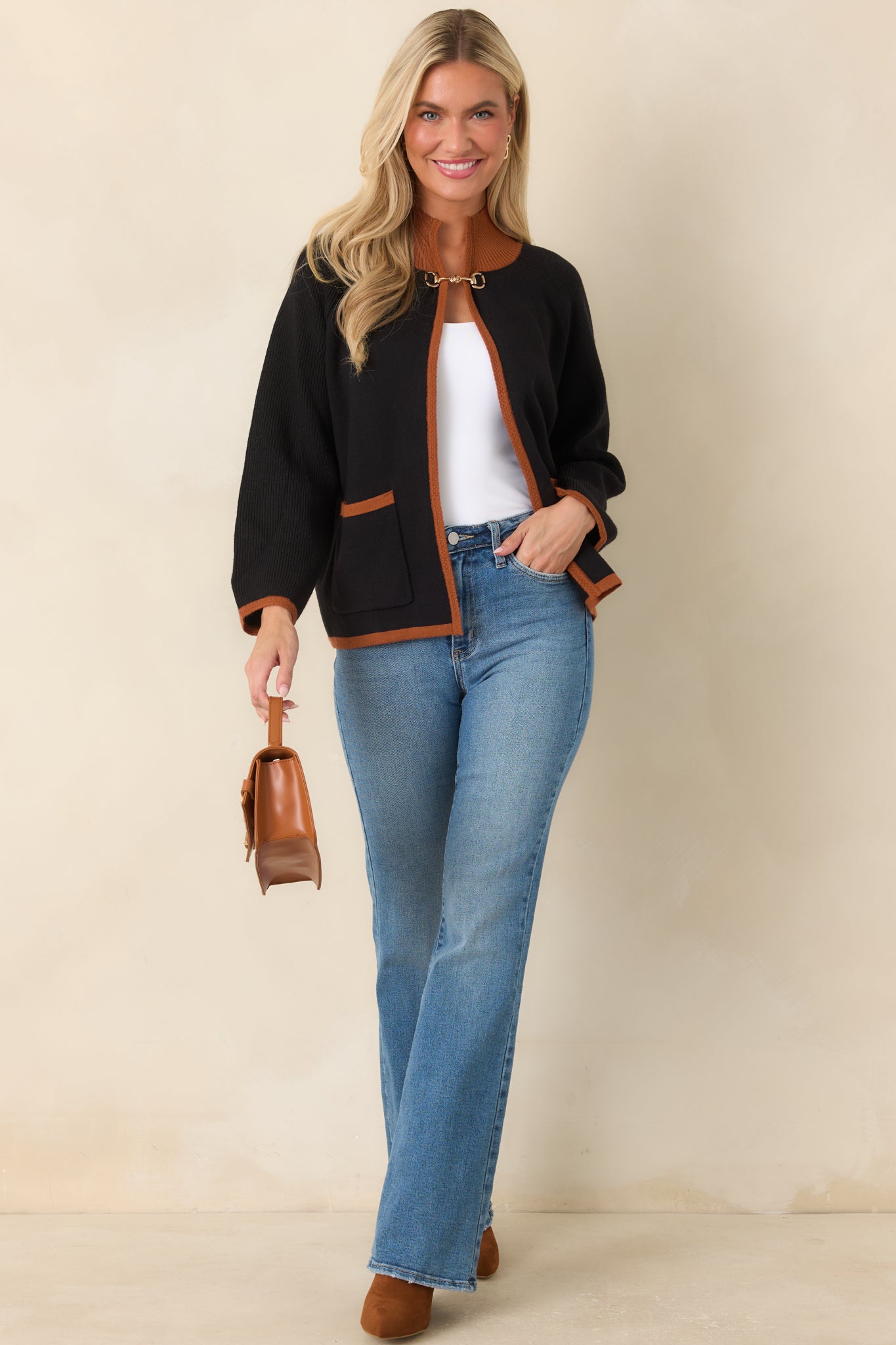 Relaxed black viscose-blend cardigan showcasing brown ribbed edging, open-front construction, patch pockets, and polished gold-tone hardware.