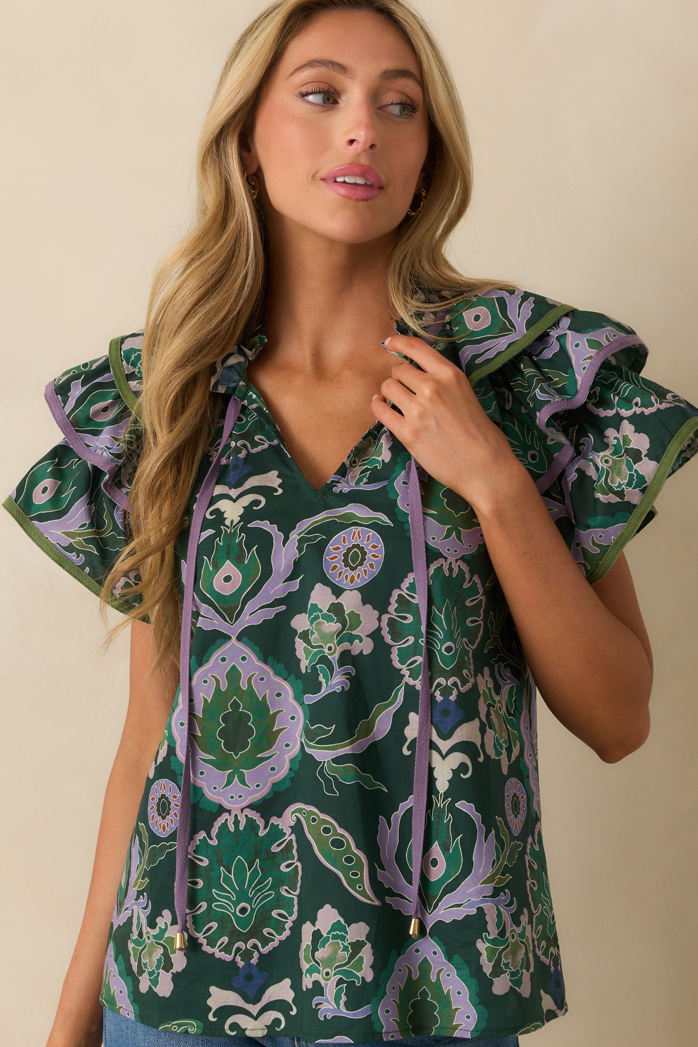 Front-focused crop emphasizing fabric texture, print, and silhouette of the blouse.