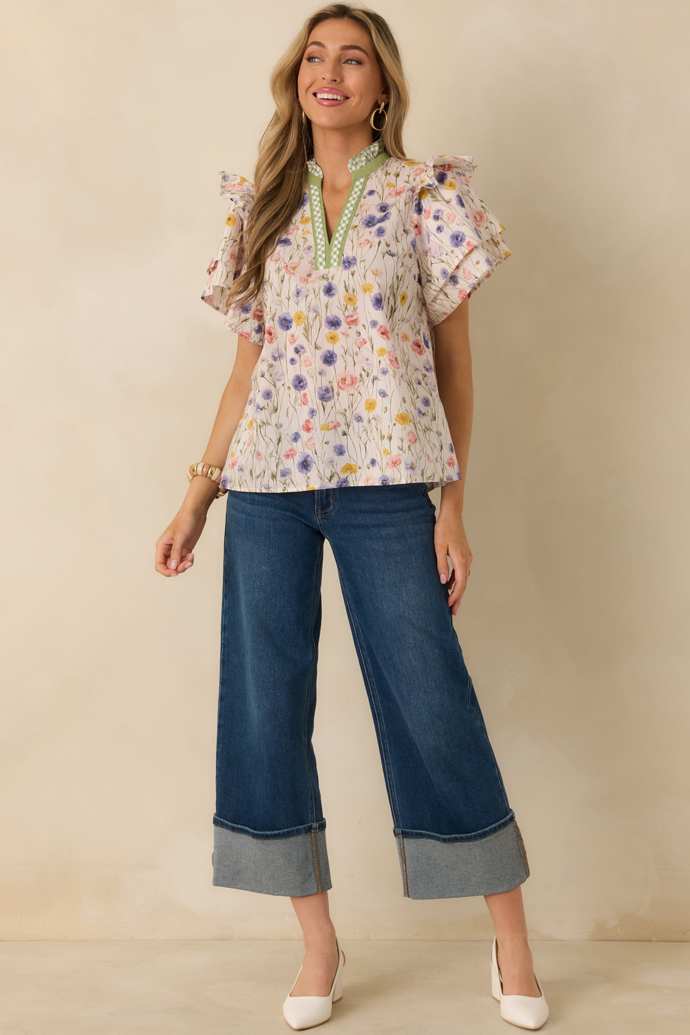 Blouse with bright mixed florals and a clean straight hemline for a lightweight, breezy everyday top.