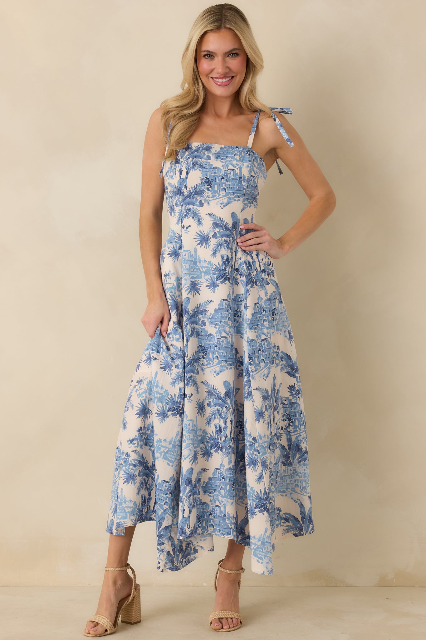Blue and ivory long dress with tie shoulder straps and flattering square neckline.