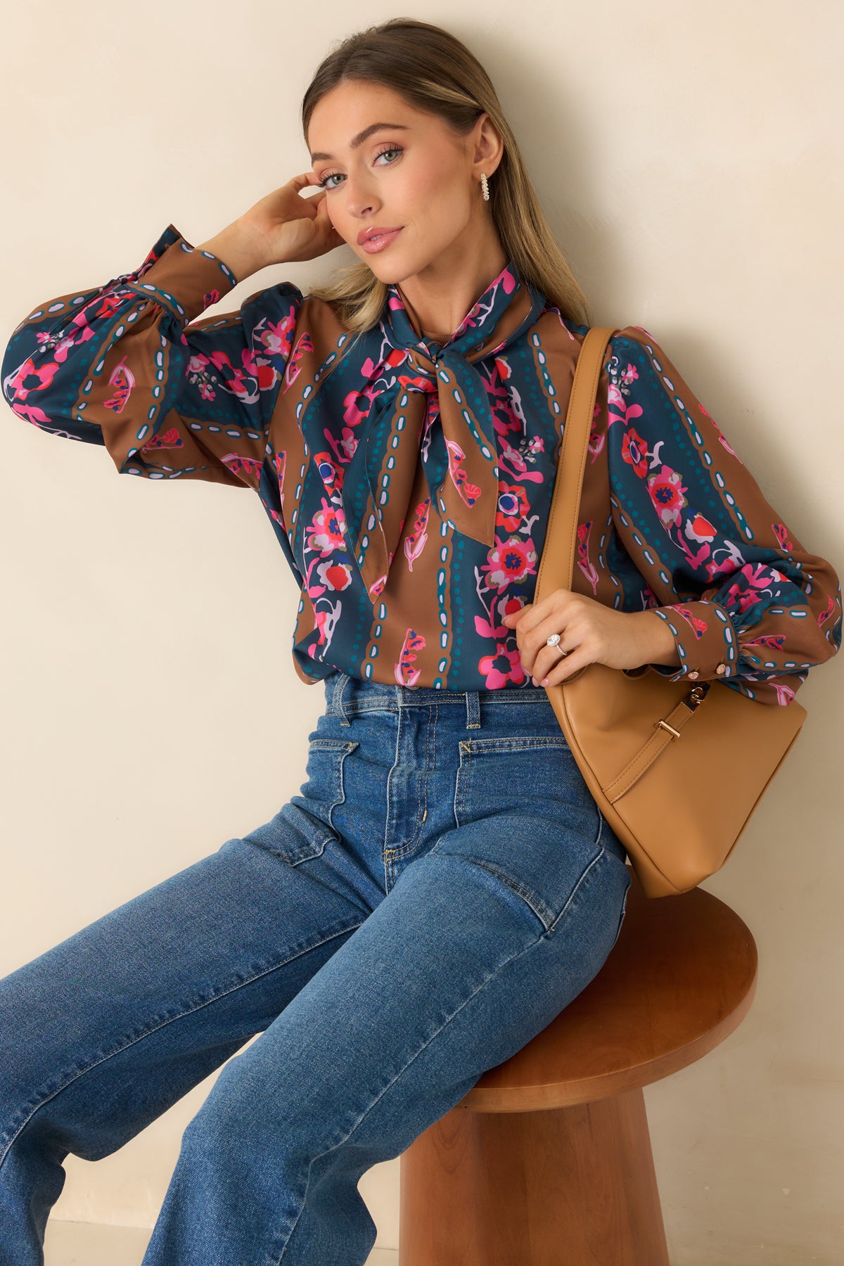 Blue and brown striped blouse decorated with pink and lilac blooms, dotted motifs, and a softly gathered neckline.