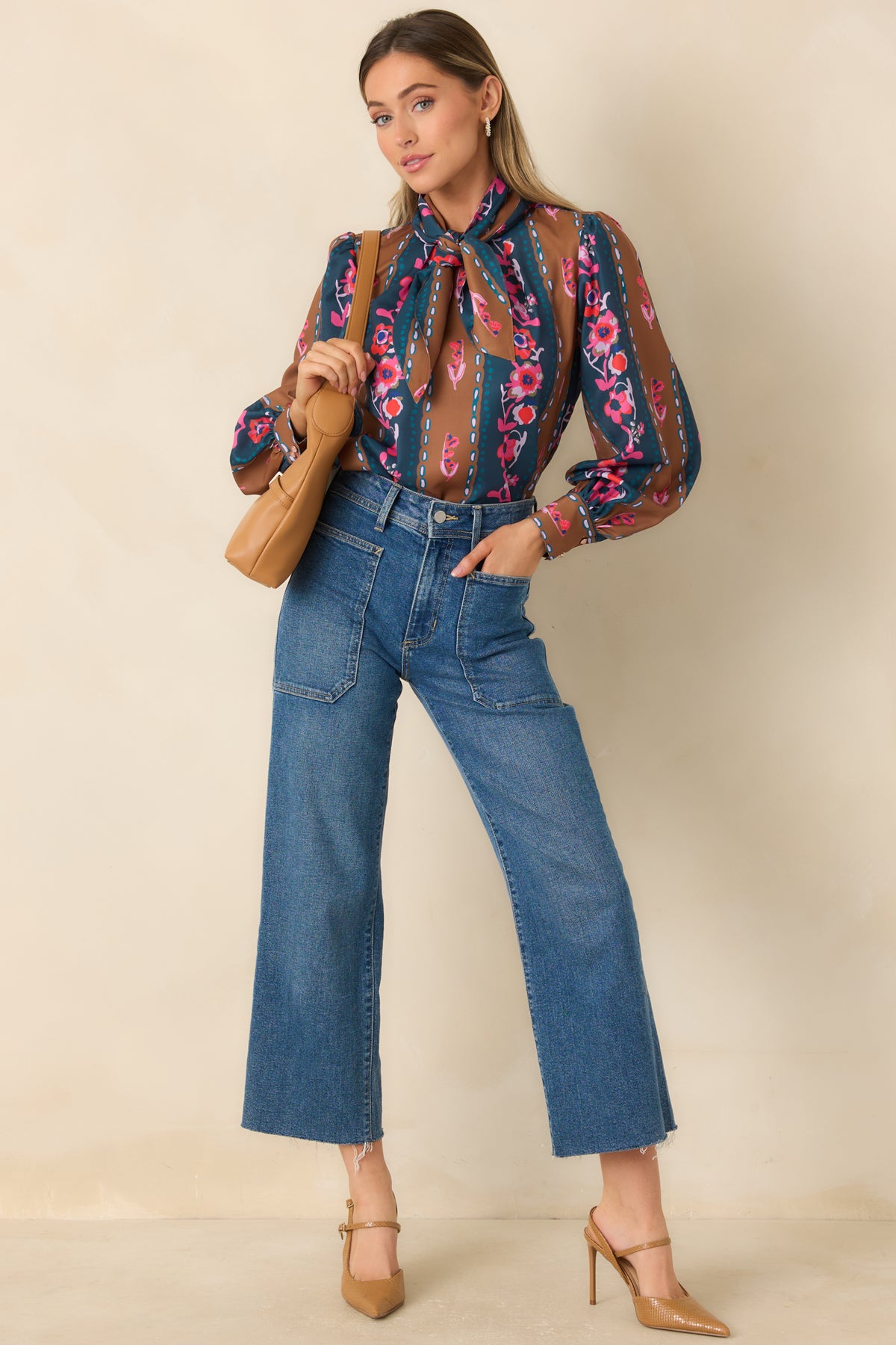 Blue and caramel striped blouse with pink, coral, and lilac florals, a removable neck tie, and long sleeves.