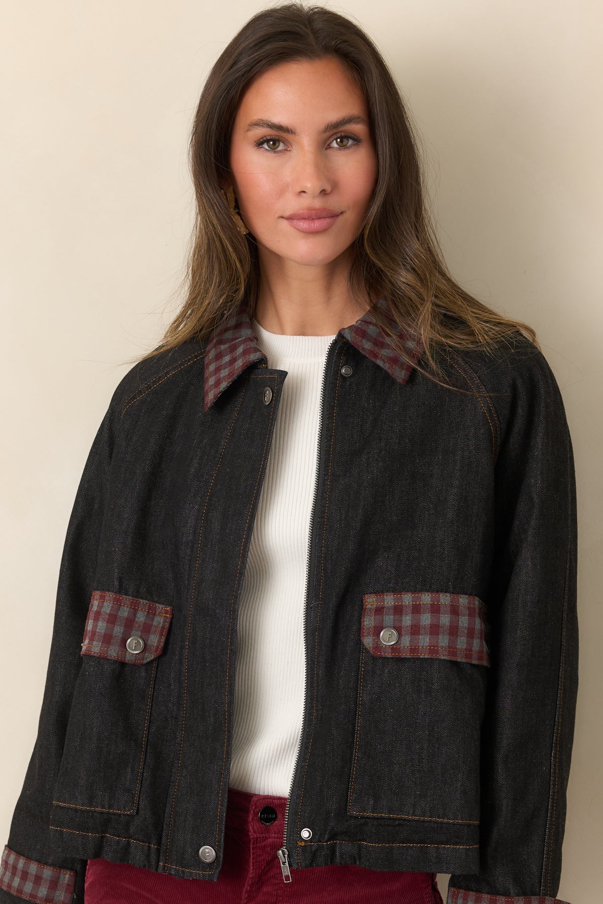 Blue denim jacket highlighting the burgundy and grey gingham collar and relaxed raglan sleeves.