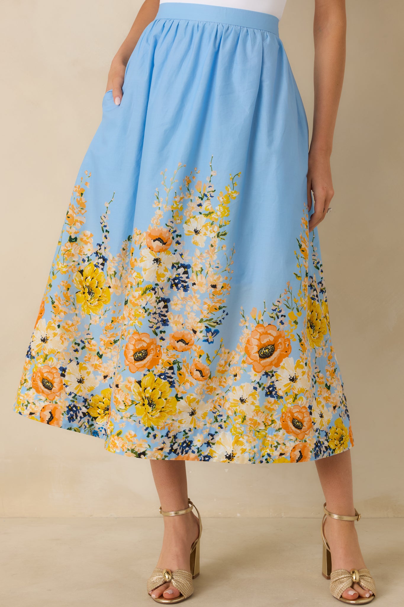 Blue flowy skirt showing the smooth elastic waistband and gentle gathers for comfortable movement.