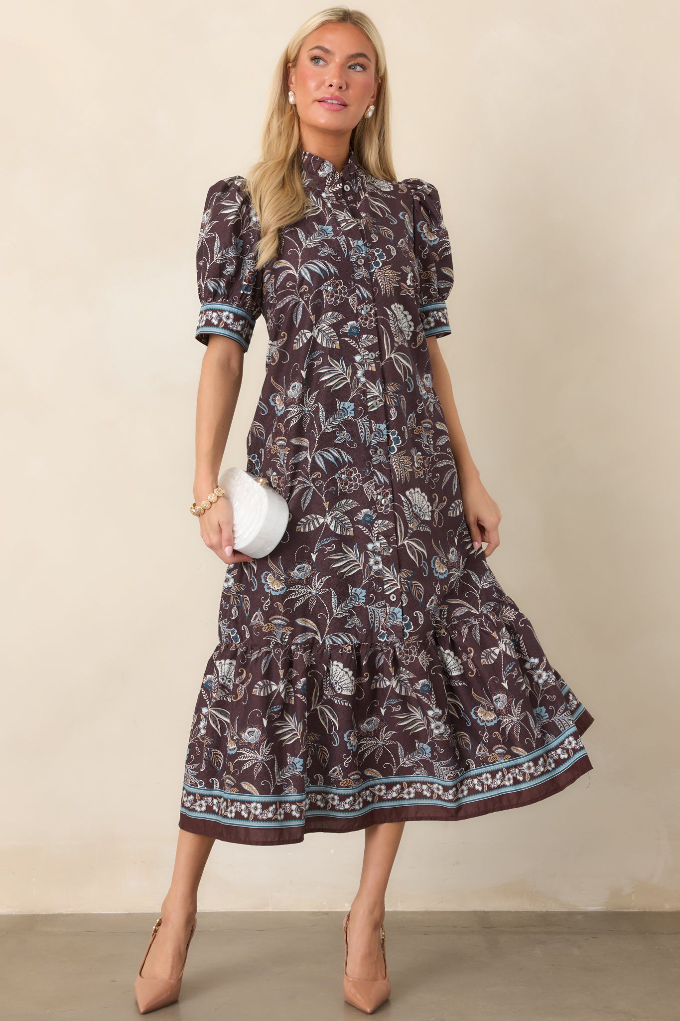 Botanical print midi shirt dress with soft blue, ivory, and neutral florals, a collared neckline, short sleeves, and button-front closure.