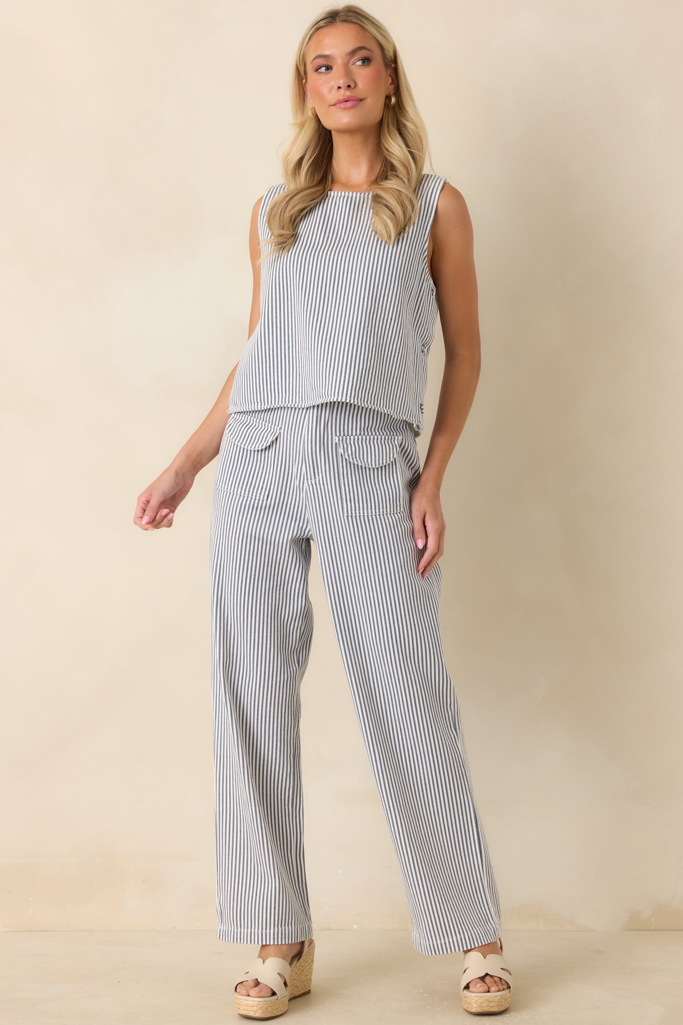 Blue and ivory knit top showcasing a classic boat neckline and an easy, laid-back silhouette.