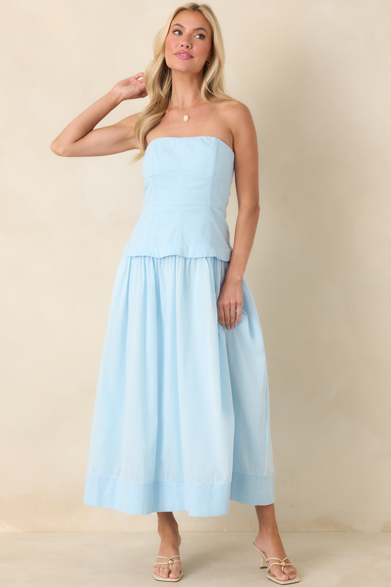 Timeless blue midi dress with a contoured paneled bodice and a breezy gathered skirt that creates a balanced, feminine shape.