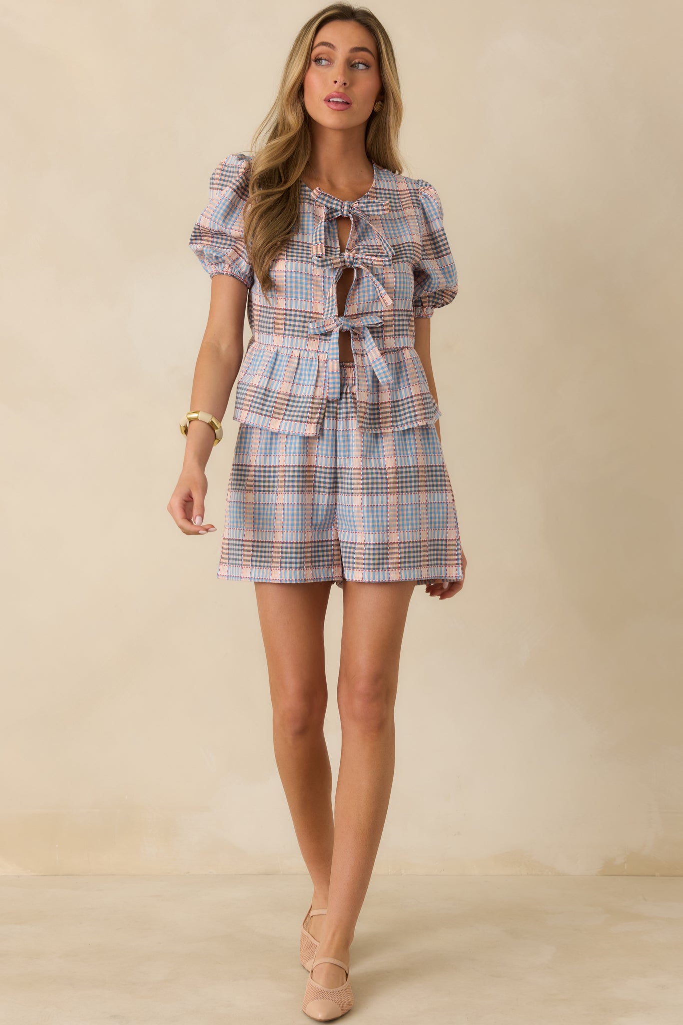 Blue multi plaid cotton shorts with a high waist, structured waistband, and relaxed leg opening.