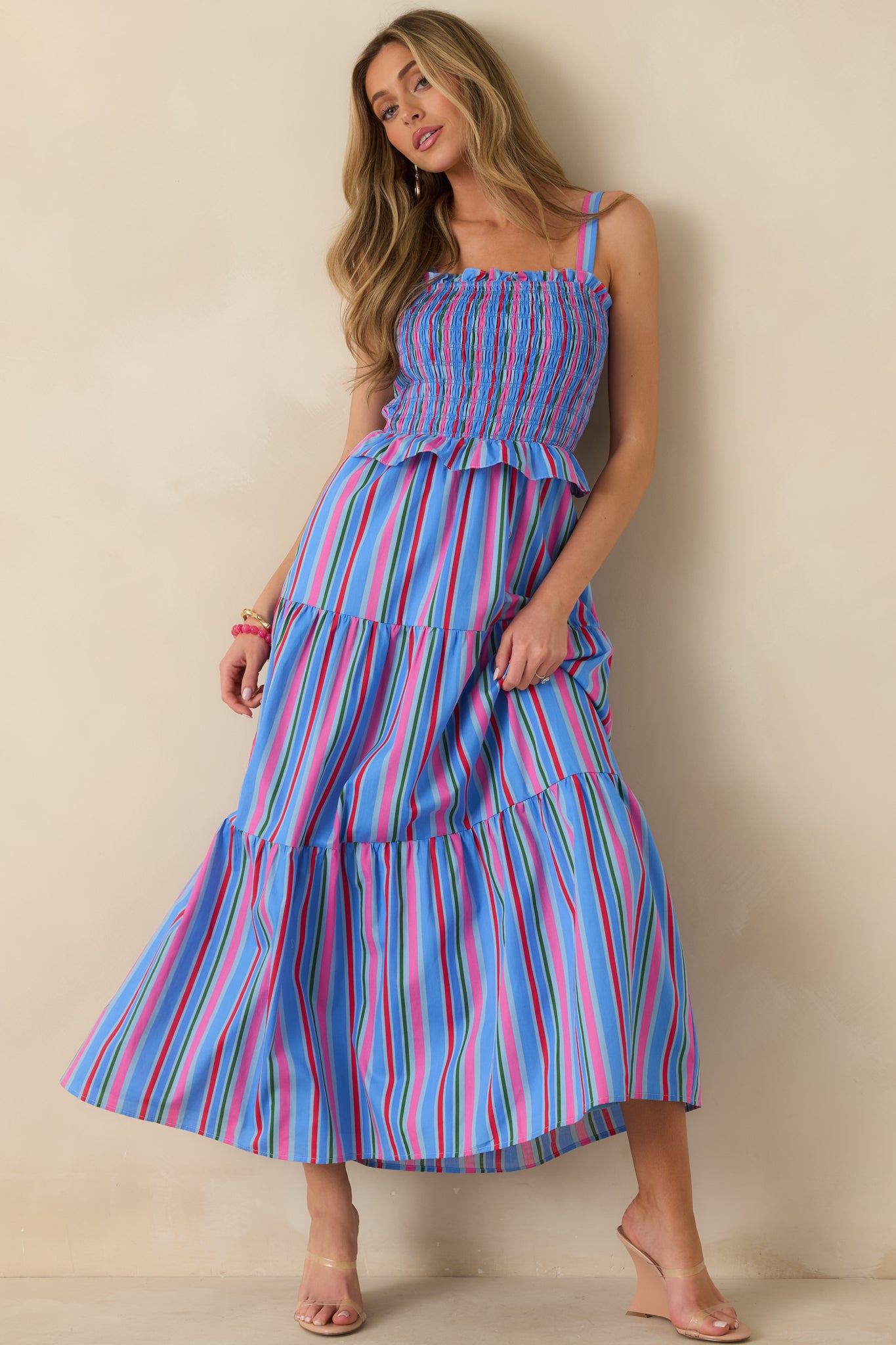 Blue multicolor maxi dress with a square neckline, adjustable shoulder straps, and a fully smocked bodice.