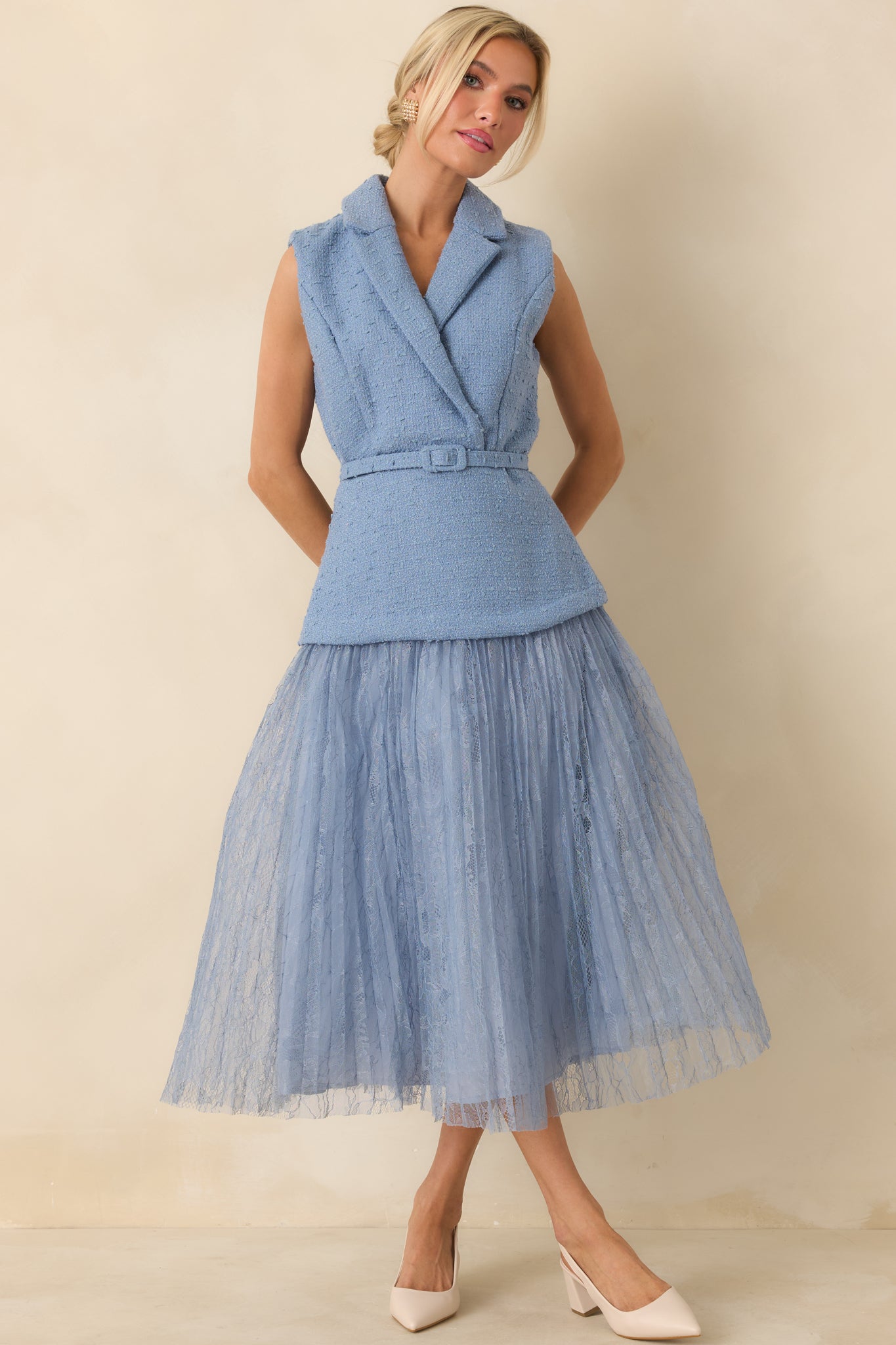 Blue tweed-inspired midi dress featuring a wrap front, removable belt, and layered pleated lace hem.