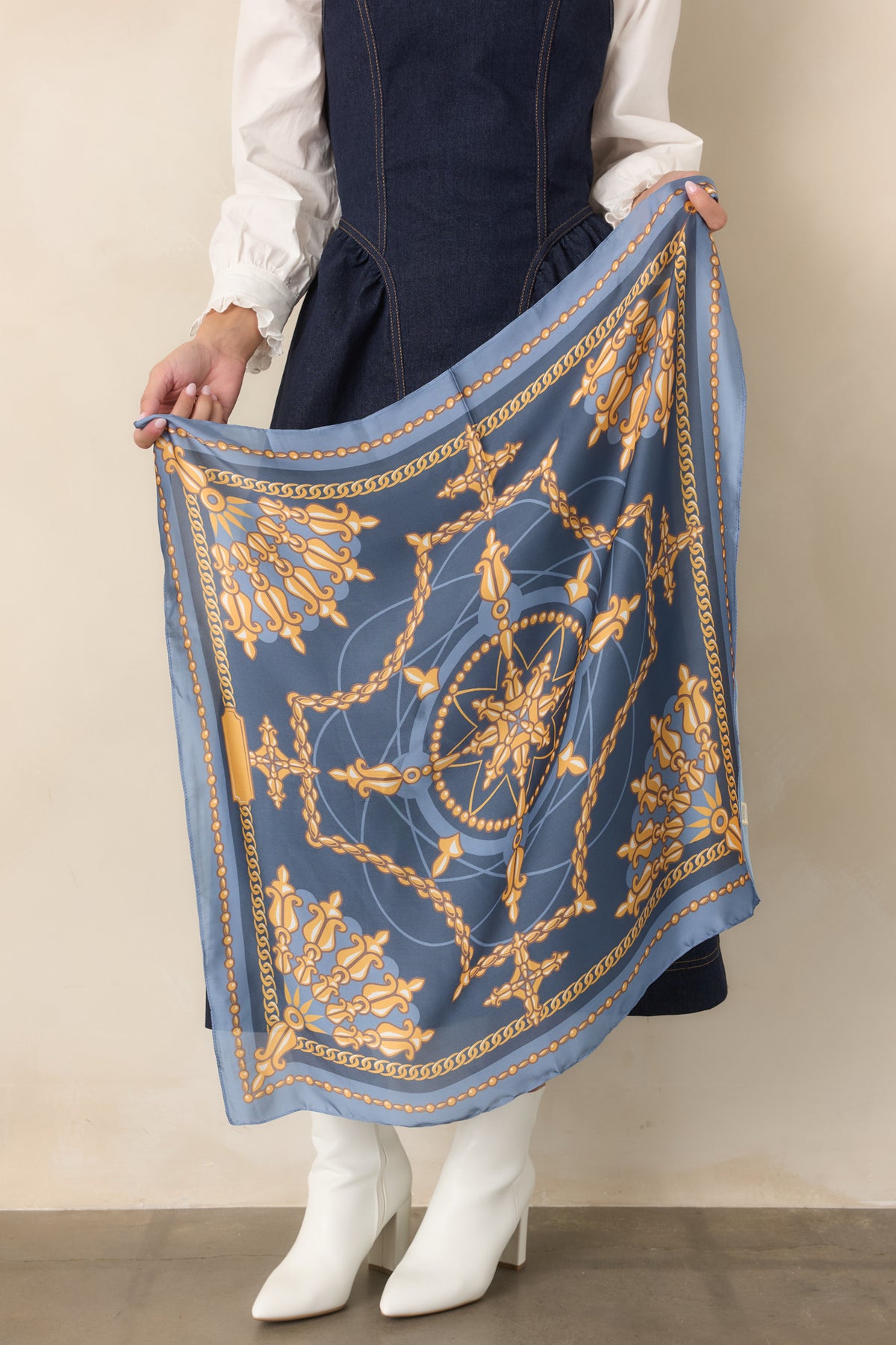  Blue scarf showcasing a vintage-inspired print with a defined blue border.