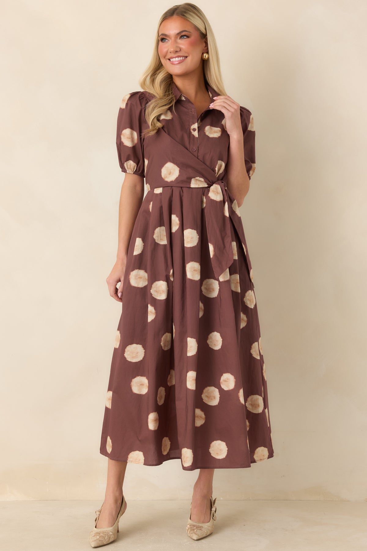 Softly blurred dot-print dress with a button-front bodice and comfortable defined waist.