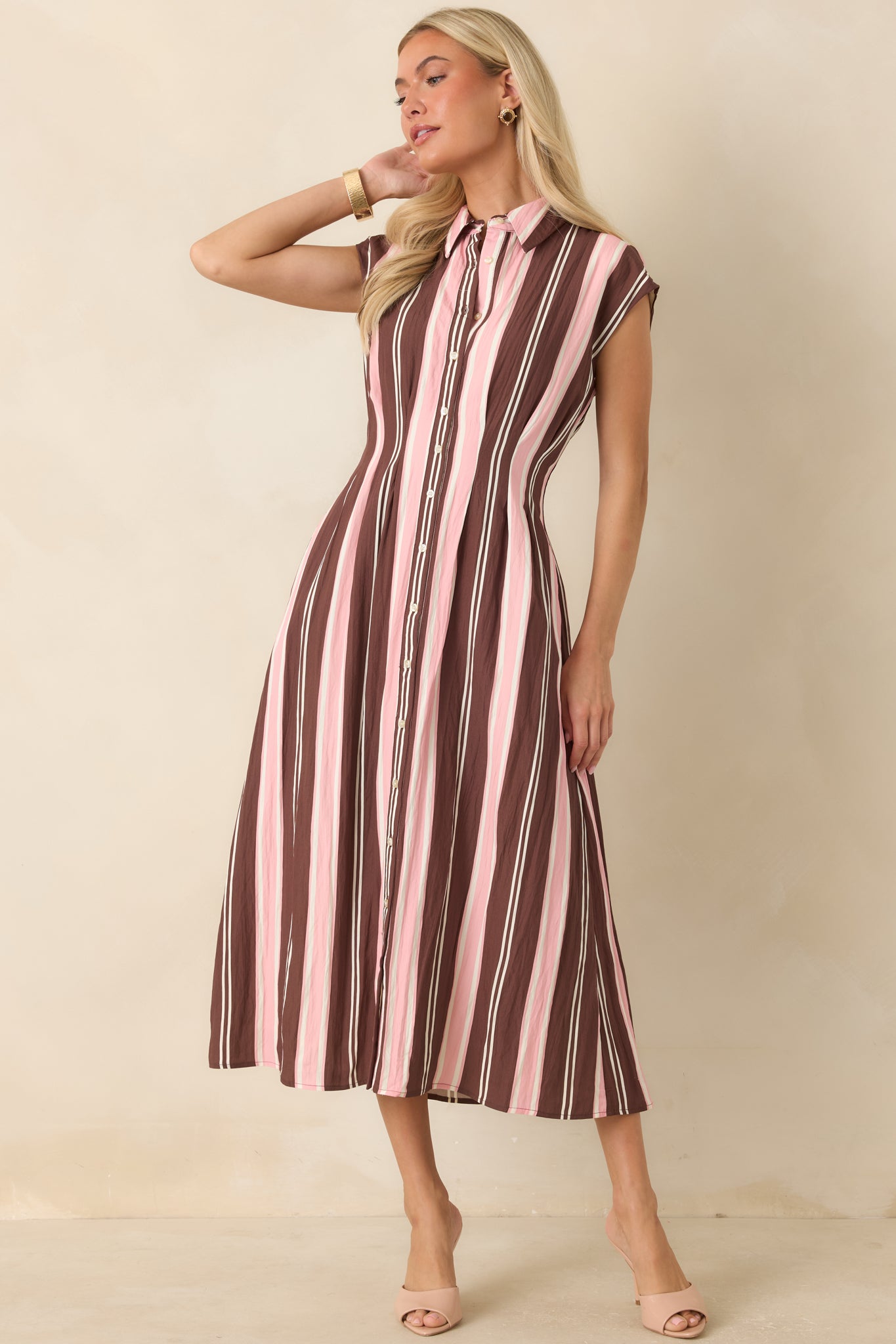 Feminine shirt dress with blush pink, ivory, and brown stripes, princess seams, and a polished midi length.