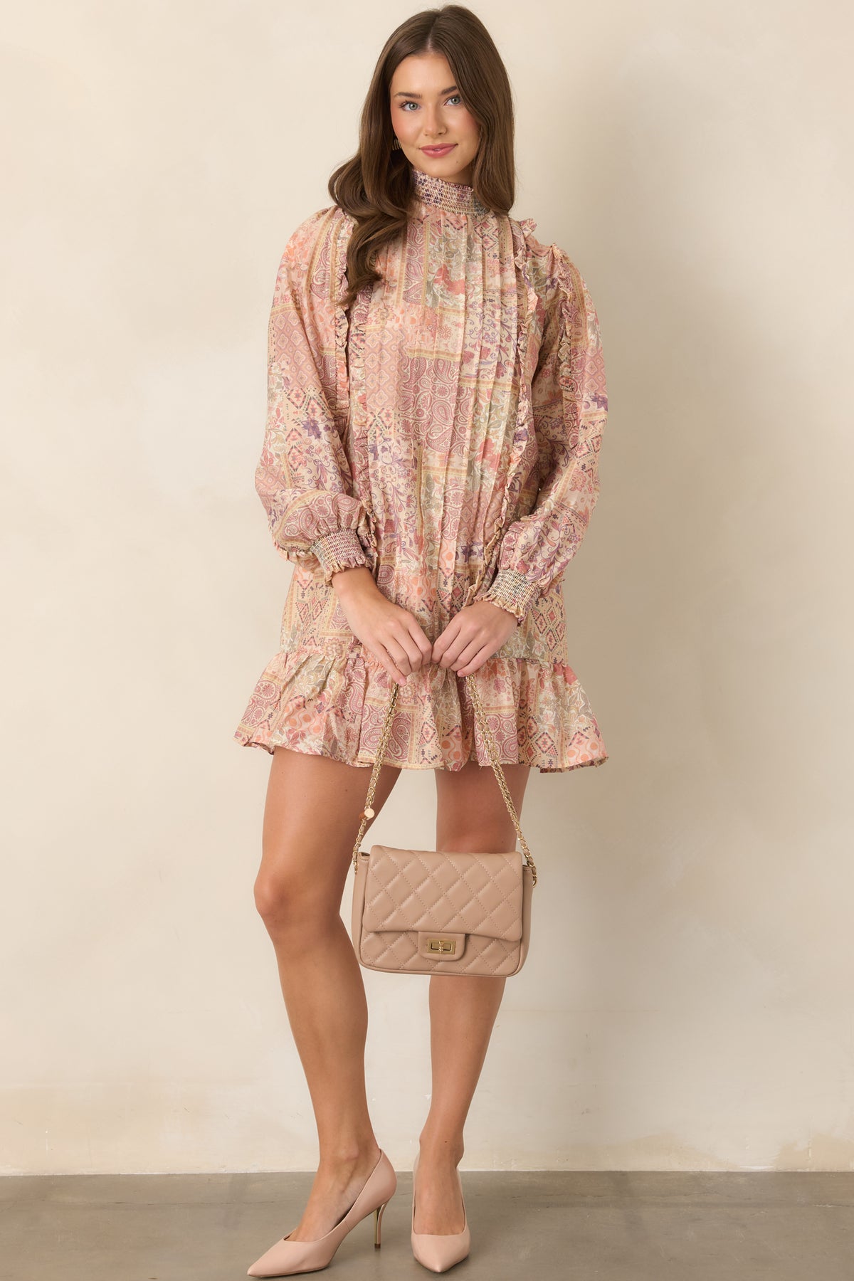 Printed mini dress showcasing soft blush, coral, lavender, sage, and ivory tones.
