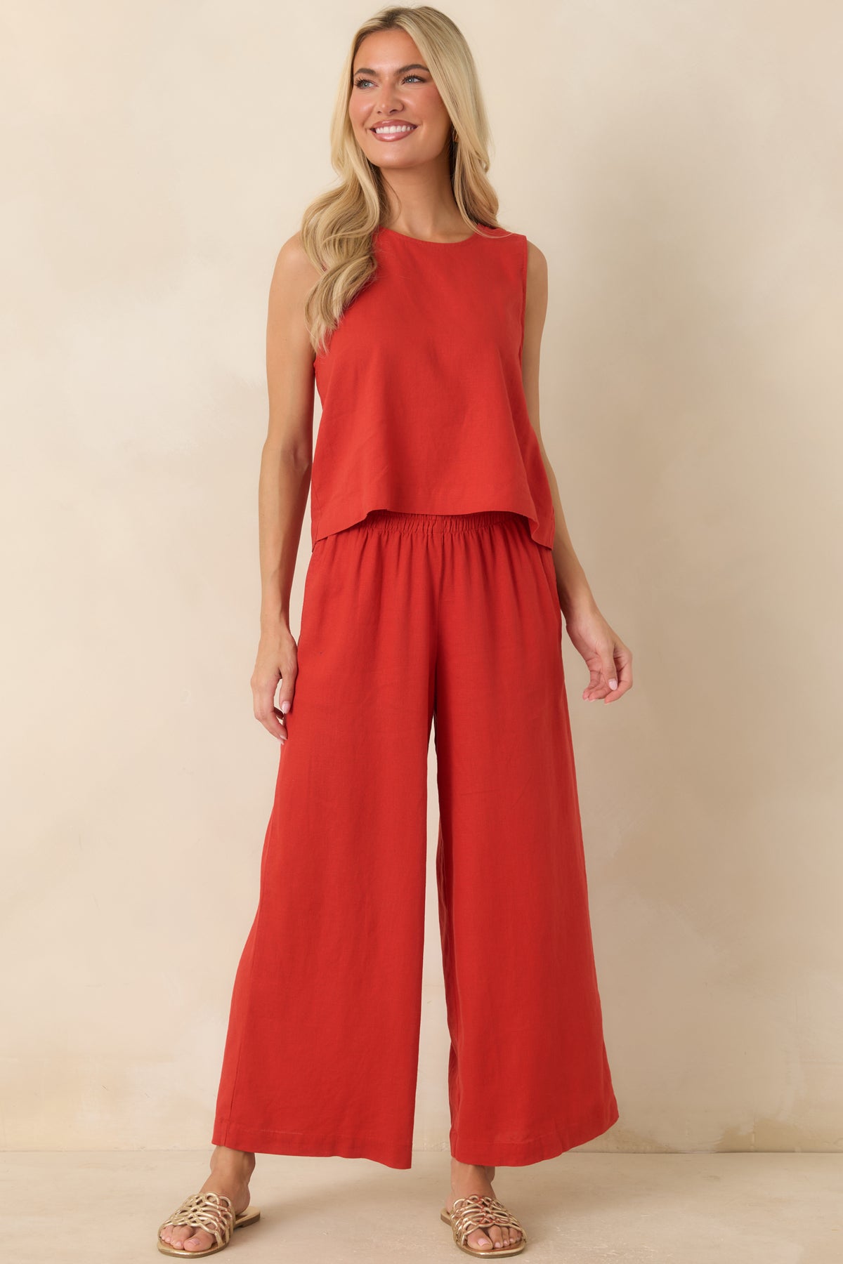 Bold red pants showcasing a comfortable silhouette, versatile design, and easygoing appeal.