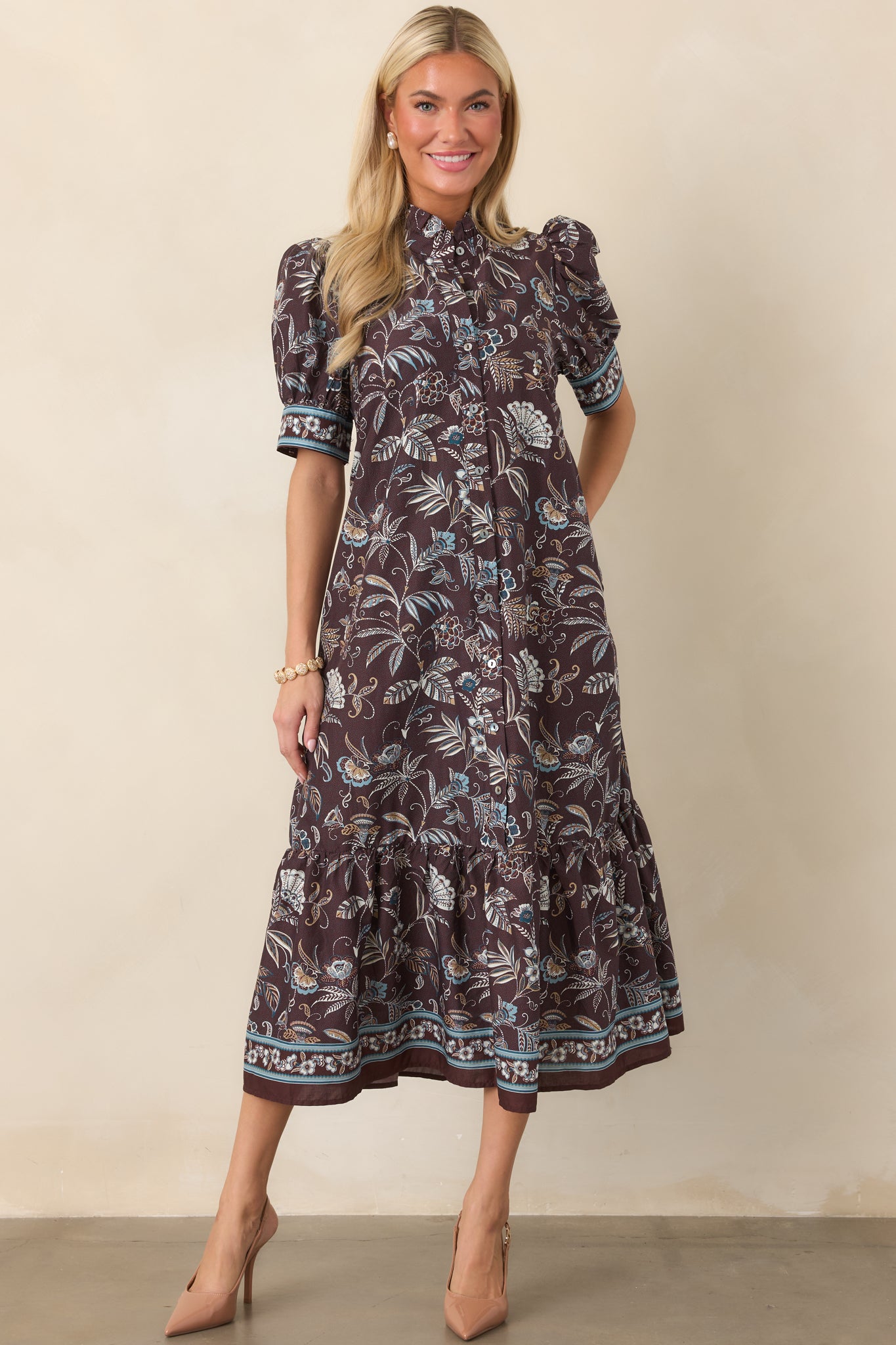 Easygoing botanical midi dress with a structured collar, short sleeves, relaxed shape, and eye-catching floral borders at the cuffs and hem.