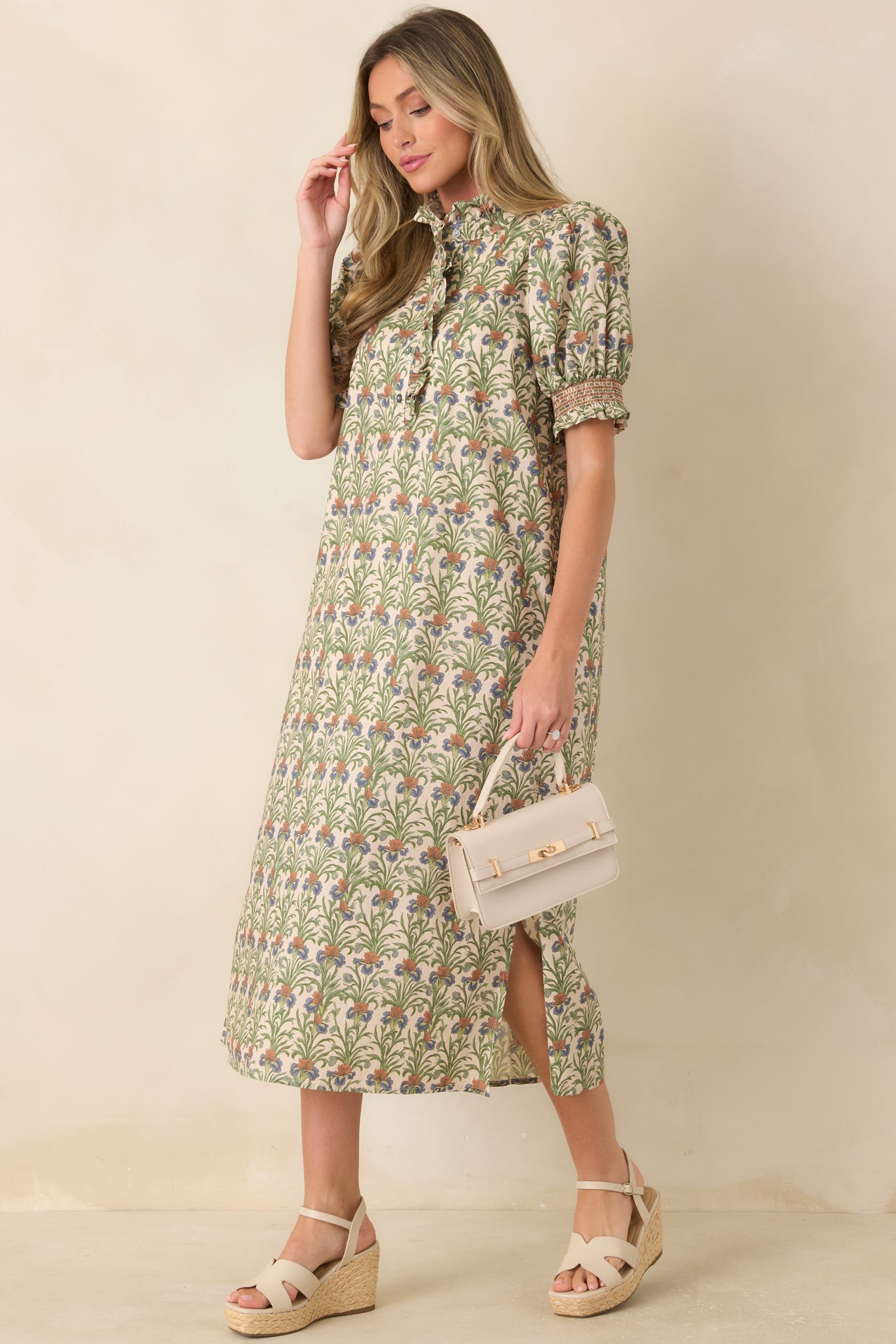 Botanical cotton dress featuring dusty blue and warm tan accents, a ruffled partial button placket, and a comfortable relaxed fit.