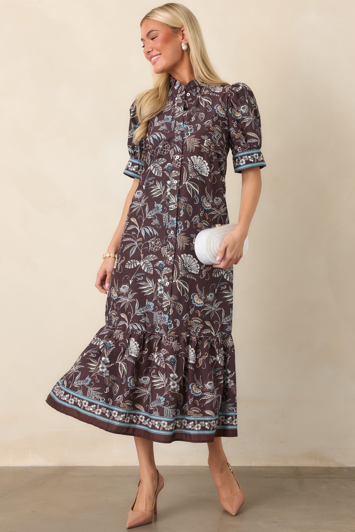 Printed shirt dress featuring delicate botanical motifs, short sleeves with floral border cuffs, and a softly flowing midi-length silhouette.