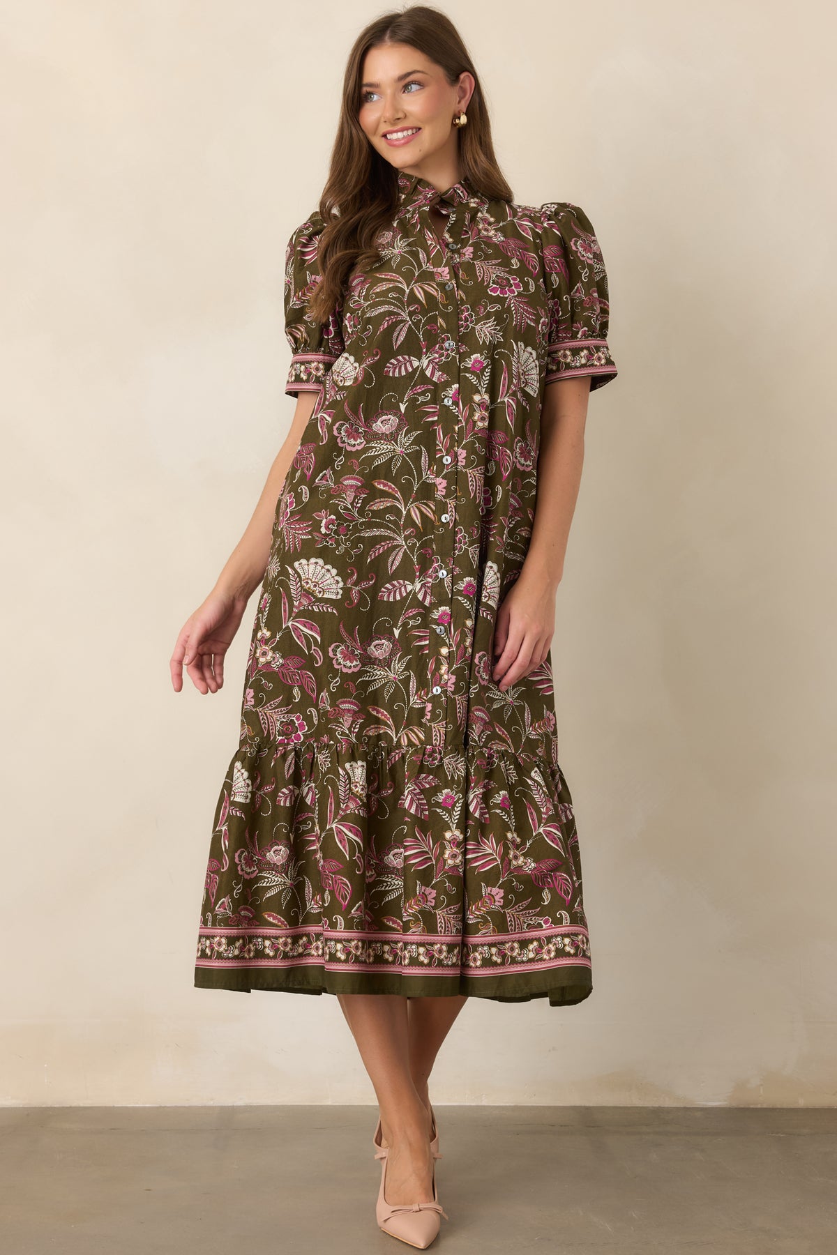 Botanical floral dress with a relaxed midi silhouette and softly detailed hem.
