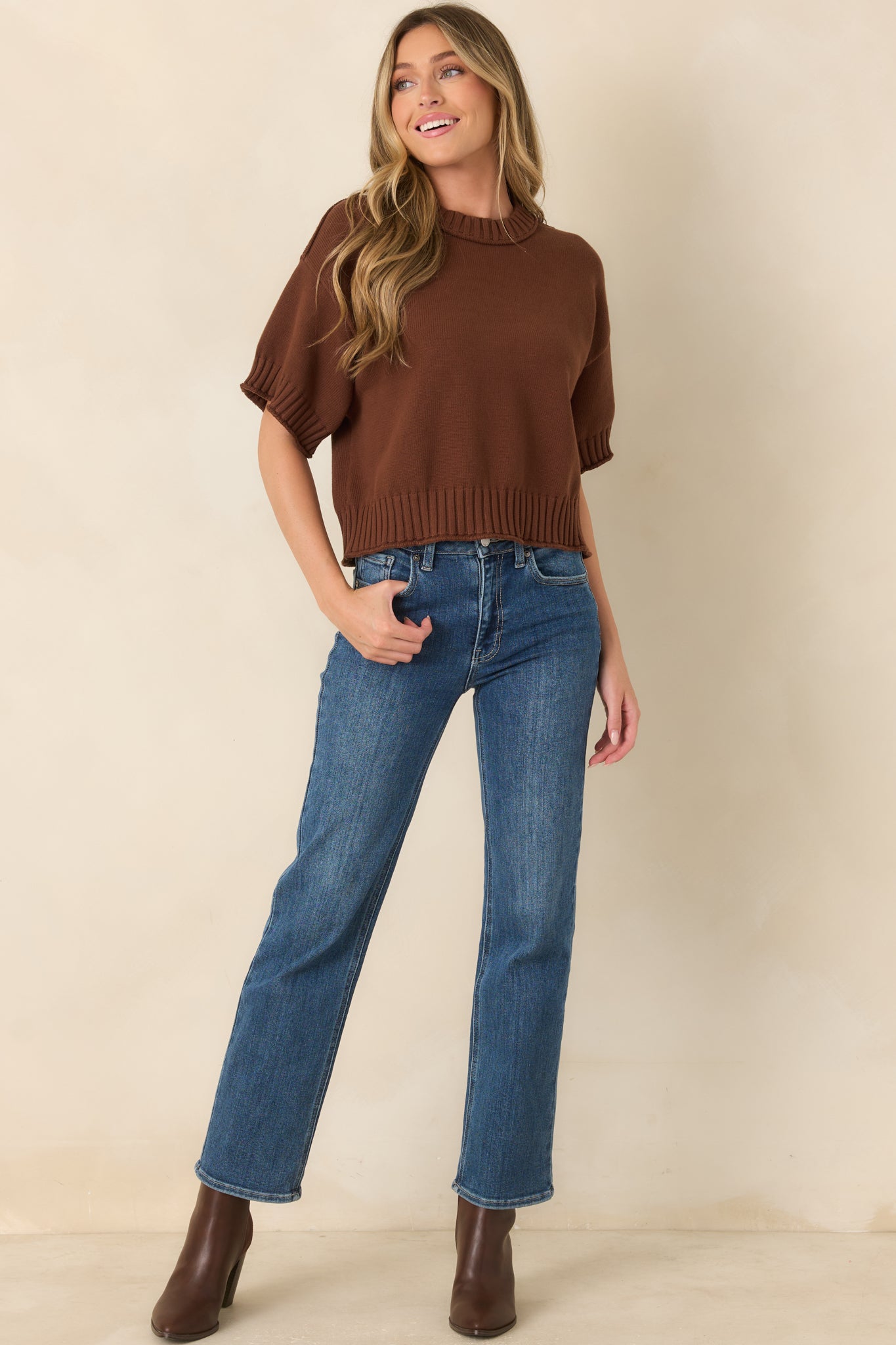 Slightly boxy cotton top with relaxed proportions and chunky ribbed trim framing the neckline, sleeve cuffs, and bottom hem.