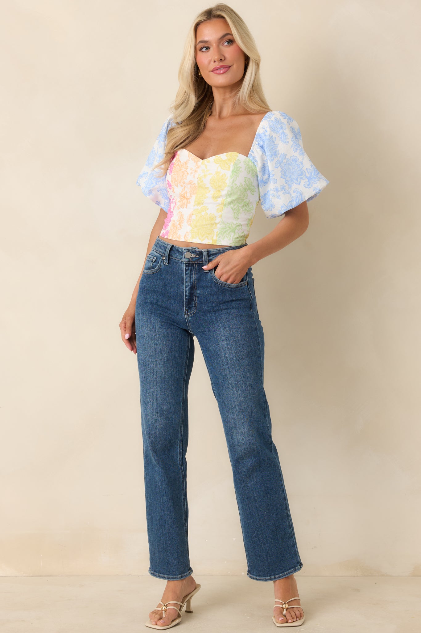 Breathable cotton linen-blend top with eye-catching color-block floral print and flattering fitted shape.