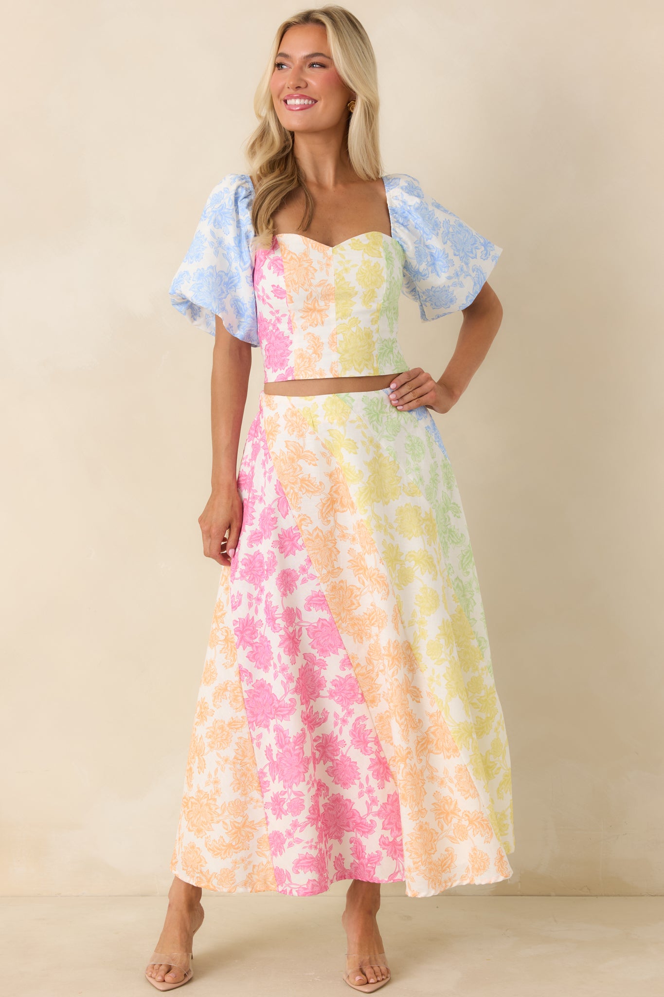Breezy cotton linen-blend skirt with voluminous silhouette, eye-catching color-block floral print, and elegant drape.