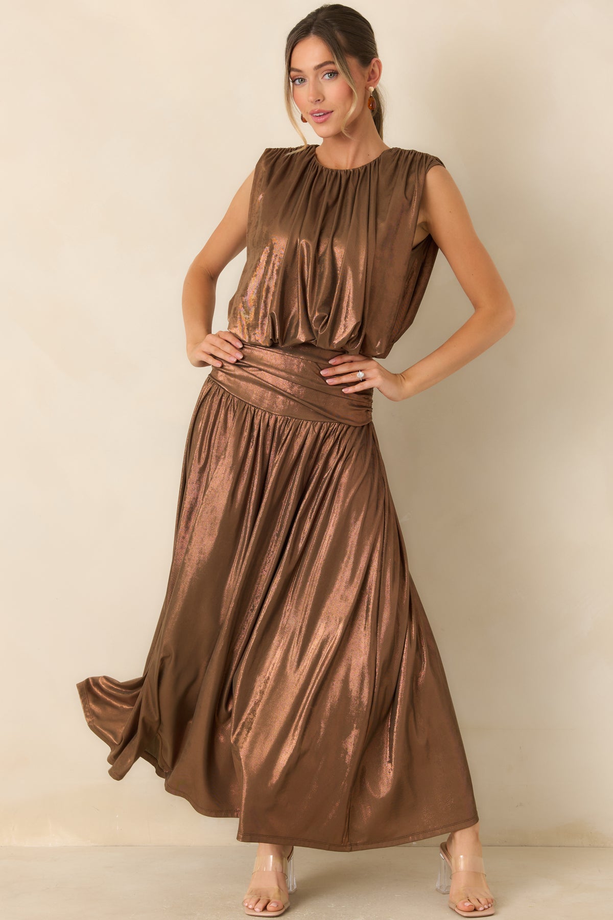 Bronze sleeveless top with a coppery sheen, gathered round neckline, and cropped bubble hem.