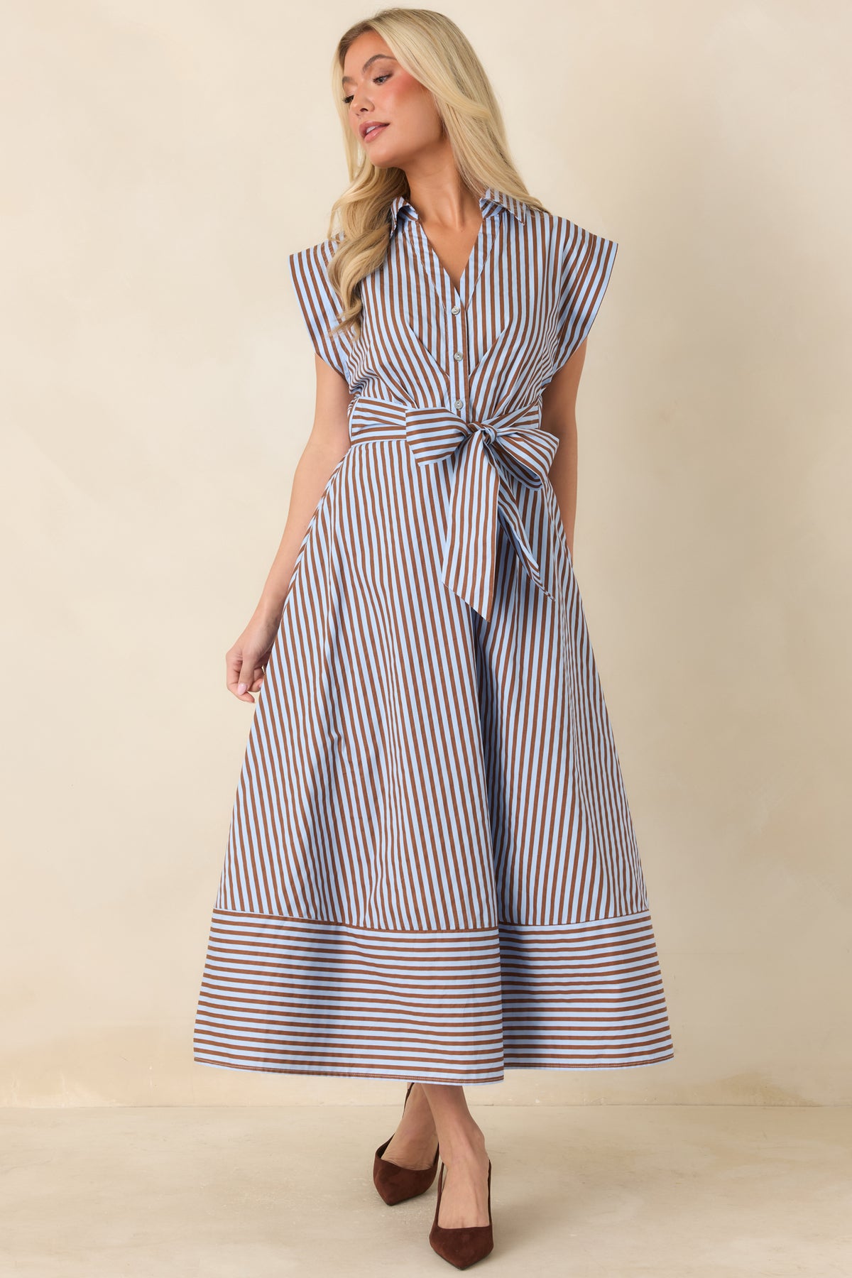 Brown and light blue midi dress with mixed stripe placement, cap sleeves, and a defined bow waist.