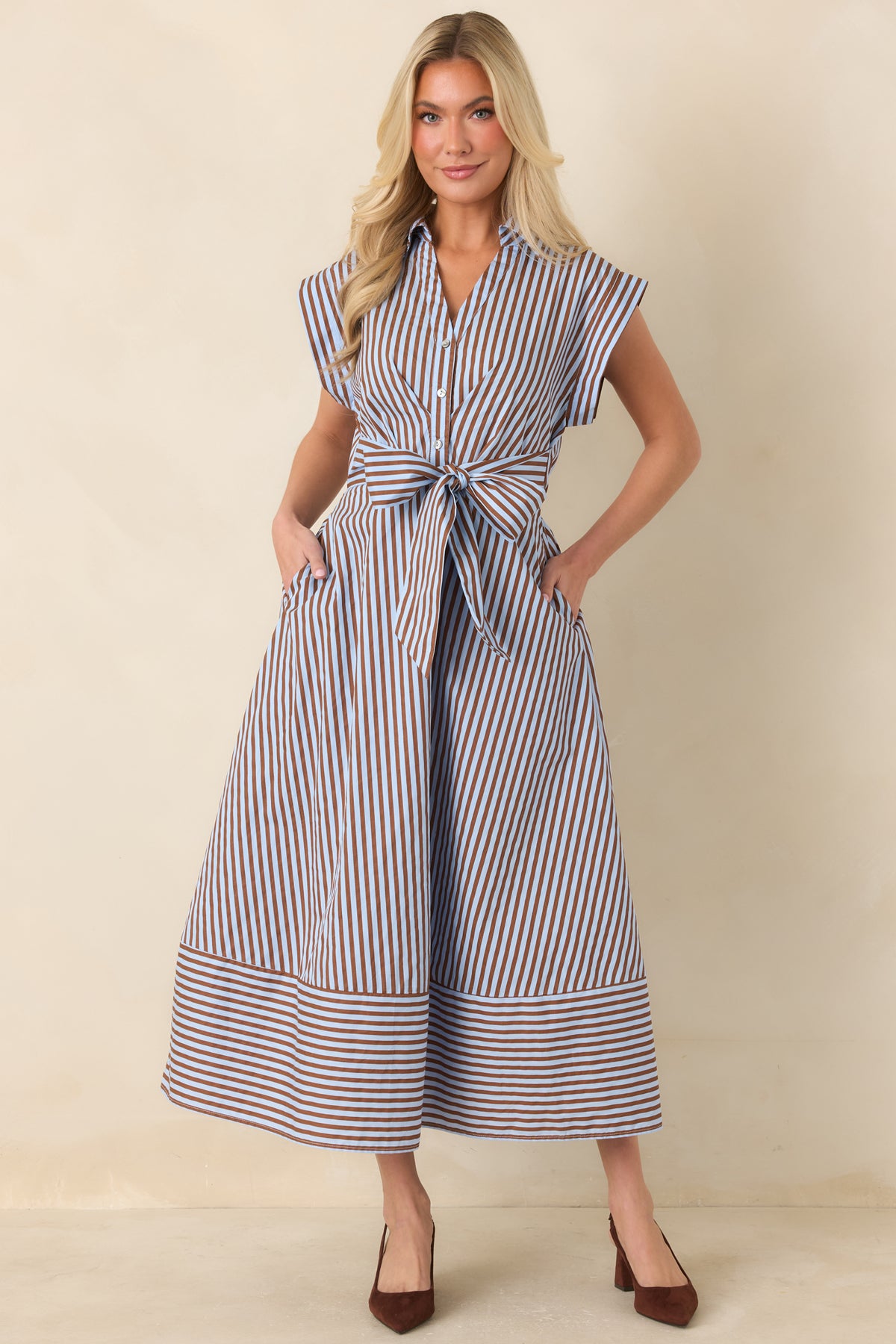 Brown and light blue striped dress with a statement waist bow, mixed stripe details, and hidden side pockets.