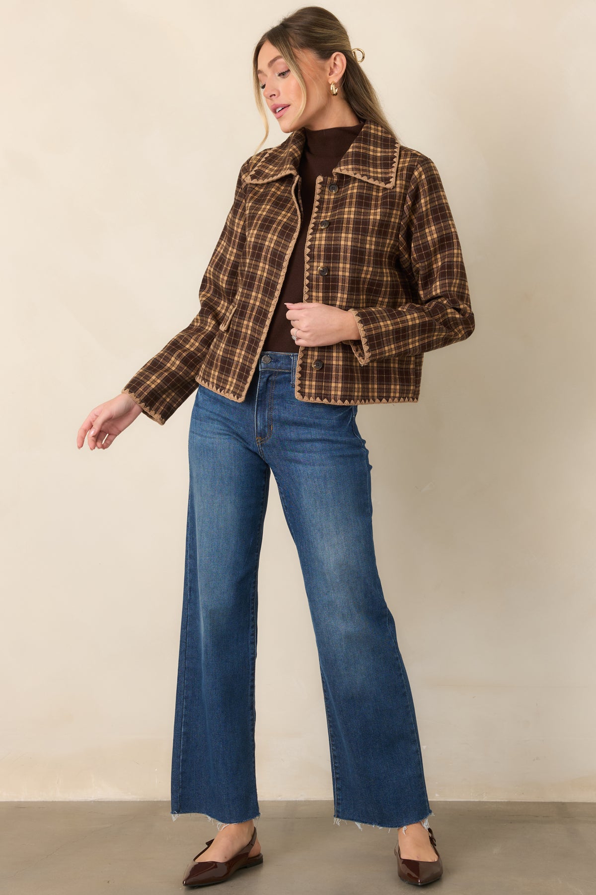 Warm plaid jacket featuring scalloped contrast stitching along the collar, button placket, pockets, and hem.