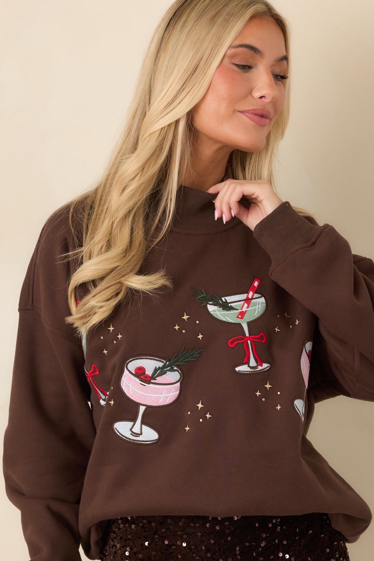 Brown cocktail-embroidered top with roomy long sleeves finished by wide ribbed cuffs.