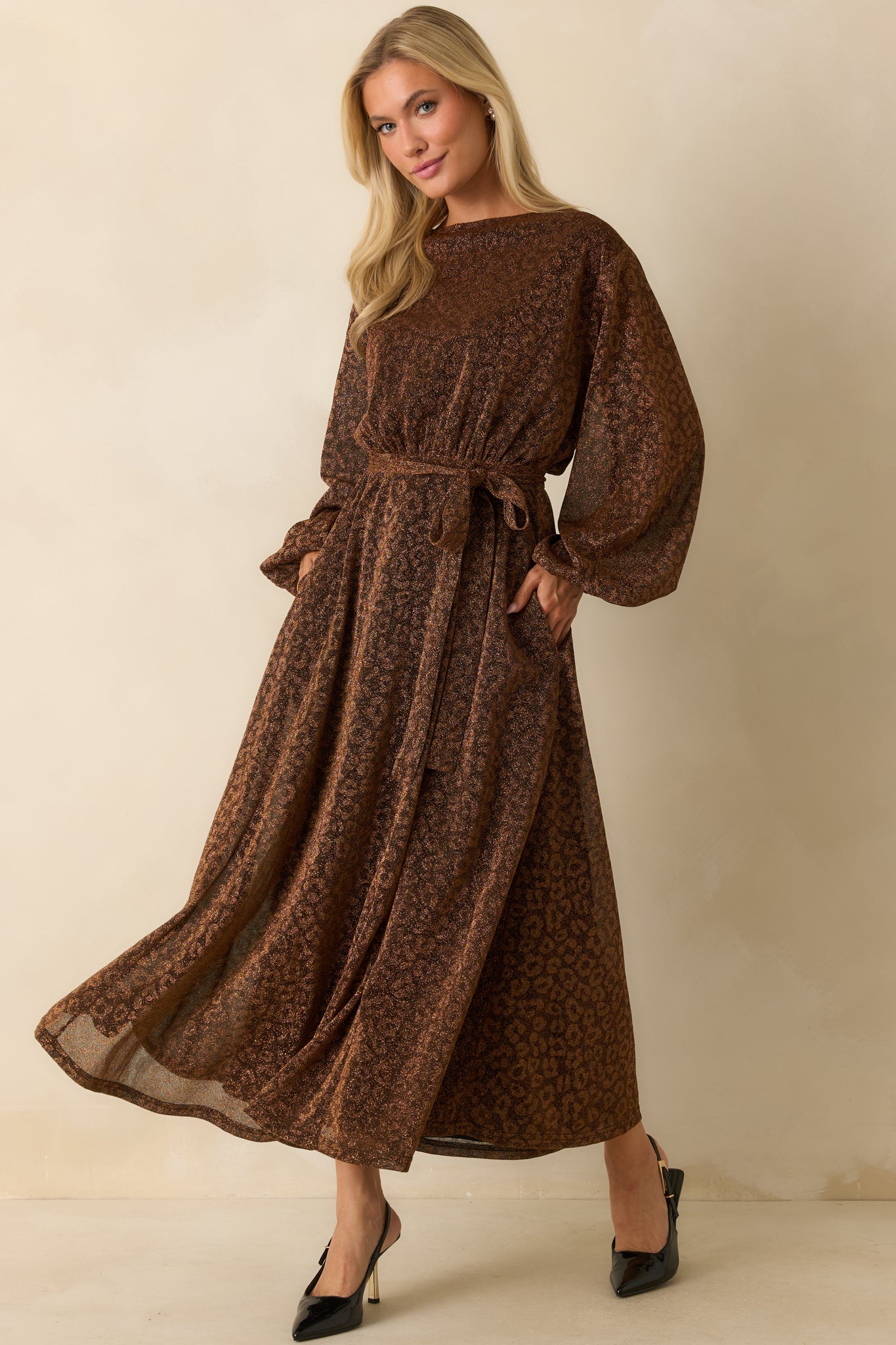 Brown shimmer midi dress with long sleeves and soft, fluid drape emphasizing the smooth woven fabric.