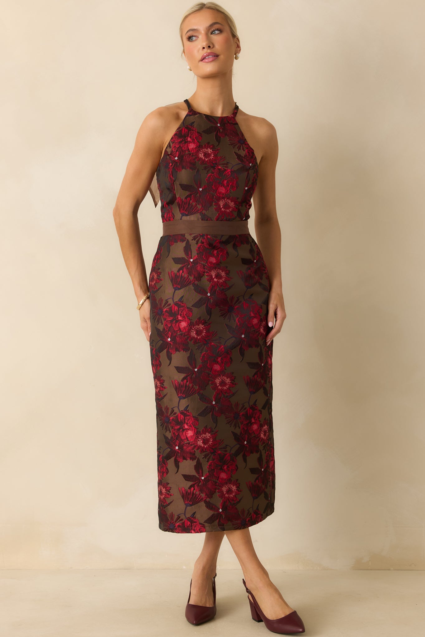 Brown floral jacquard dress with a polished A-line drape and subtle texture from the woven fabric.