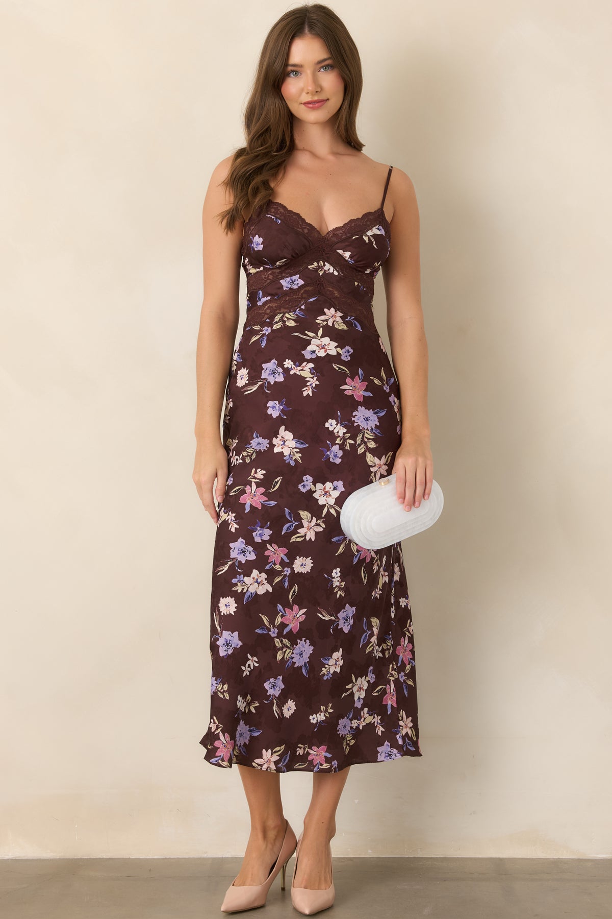 Brown floral satin dress showcasing its fitted bodice, delicate shoulder straps, lace-accented bust and waist, and softly flowing floor-length skirt.