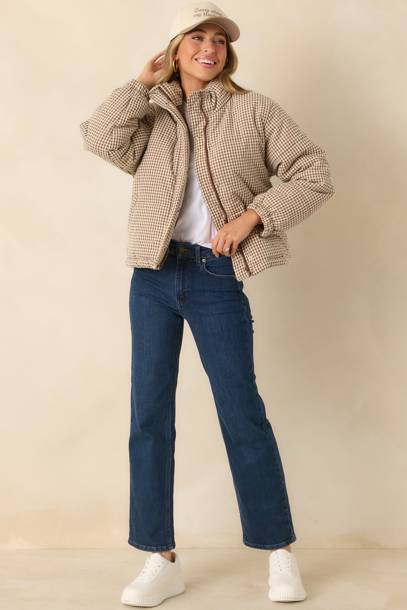 Lightweight brown gingham coat featuring a zip and snap front closure, long sleeves, and functional side pockets.