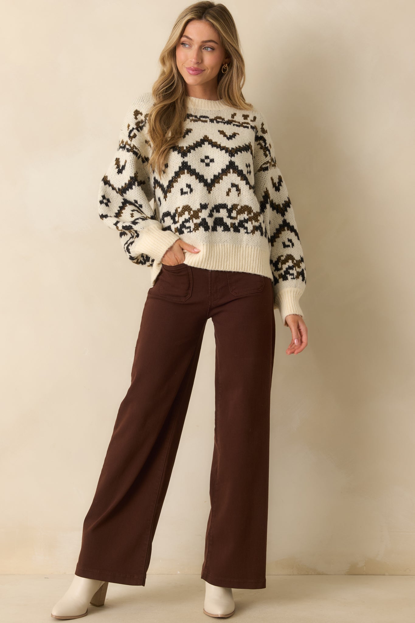 Brown jeans with a high-rise waist and straight leg silhouette, featuring front patch pockets.